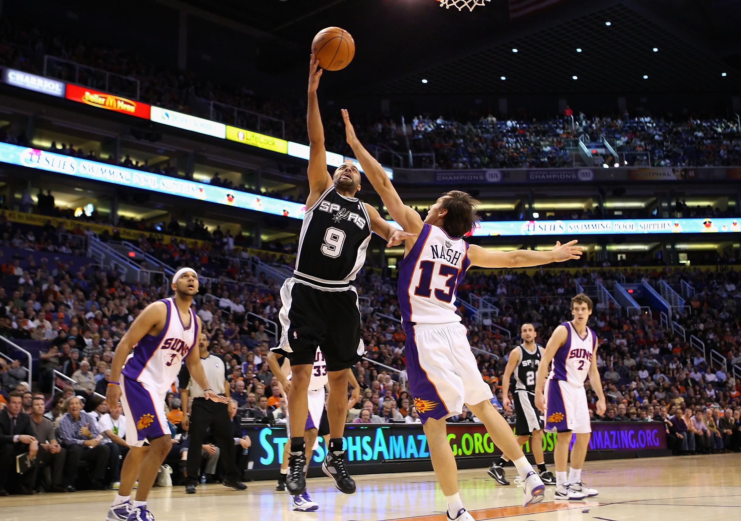 PHOENIX - DECEMBER 15:  Tony Parker #9 of the San Antonio Spurs lays up a shot during the NBA game against the Phoenix Suns at US Airways Center on December 15, 2009 in Phoenix, Arizona. The Suns defeated the Spurs 116-104. NOTE TO USER: User expressly ac