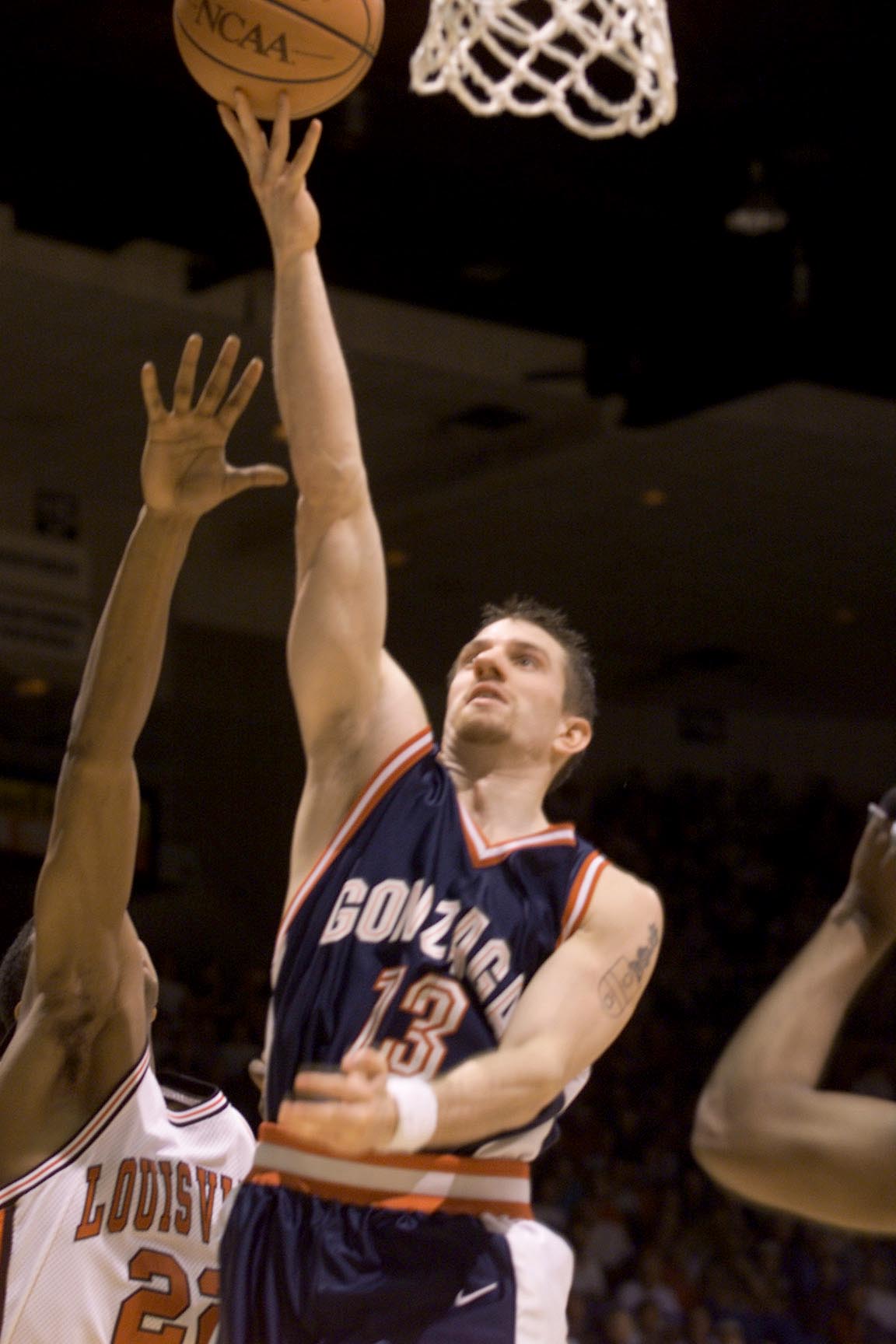 16 Mar 2000:  Matt Santangelo of Gonzaga shoots over Reece Gaines of Louisville during the first round of the Western Regional NCAA Tournament at the McKale Center in Tucson, Arizona. X DIGITAL IMAGE Mandatory Credit: Jed Jacobsohn/ALLSPORT