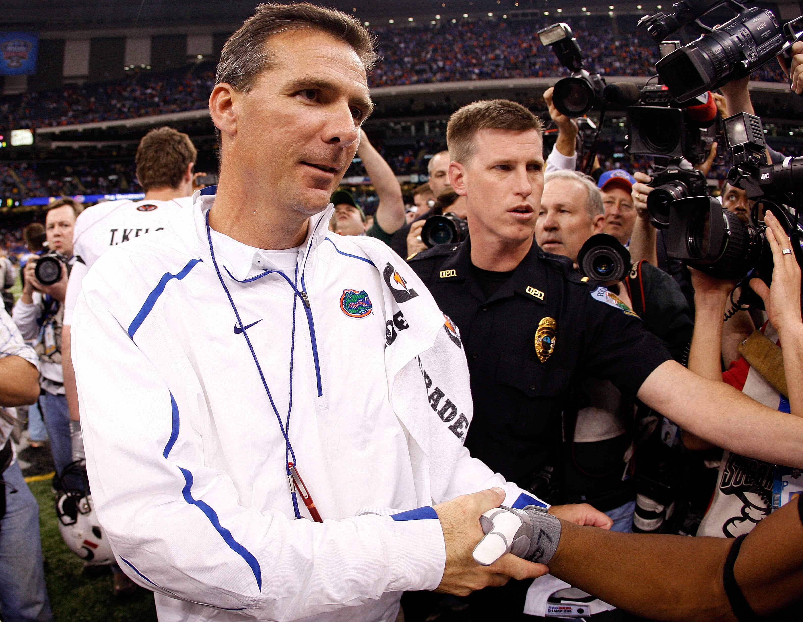 NEW ORLEANS - JANUARY 01:  Head coach Urban Meyer of the Florida Gators walks off the field after the Gators defeated the Bearcats 24-51 in the Allstate Sugar Bowl at the Louisana Superdome on January 1, 2010 in New Orleans, Louisiana.  (Photo by Chris Gr