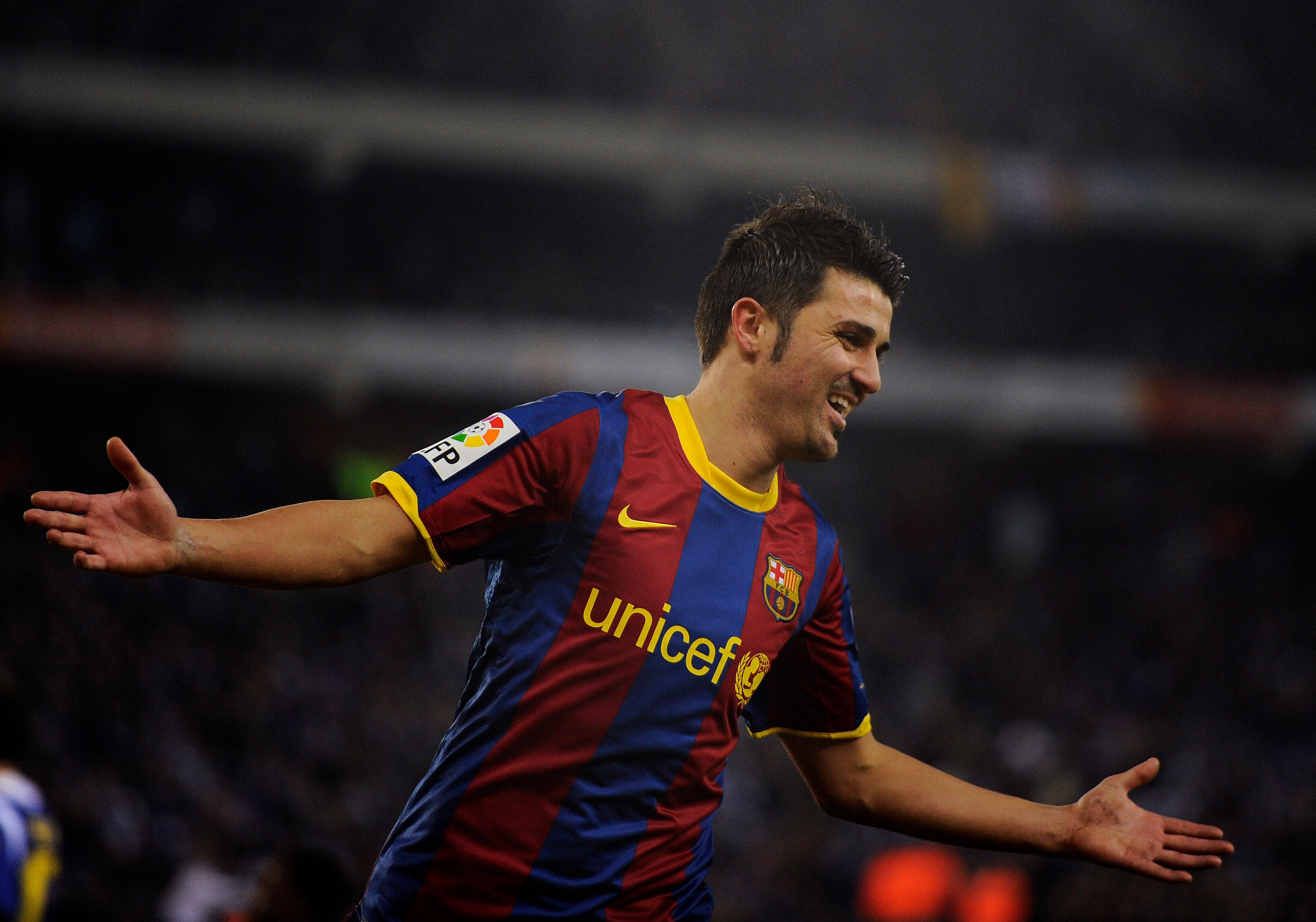 BARCELONA, SPAIN - DECEMBER 18:  David Villa of Barcelona celebrates after scoring his fifth team's goal during the La Liga match between Espanyol and Barcelona at Cornella - El Prat stadium on December 18, 2010 in Barcelona, Spain.  (Photo by David Ramos