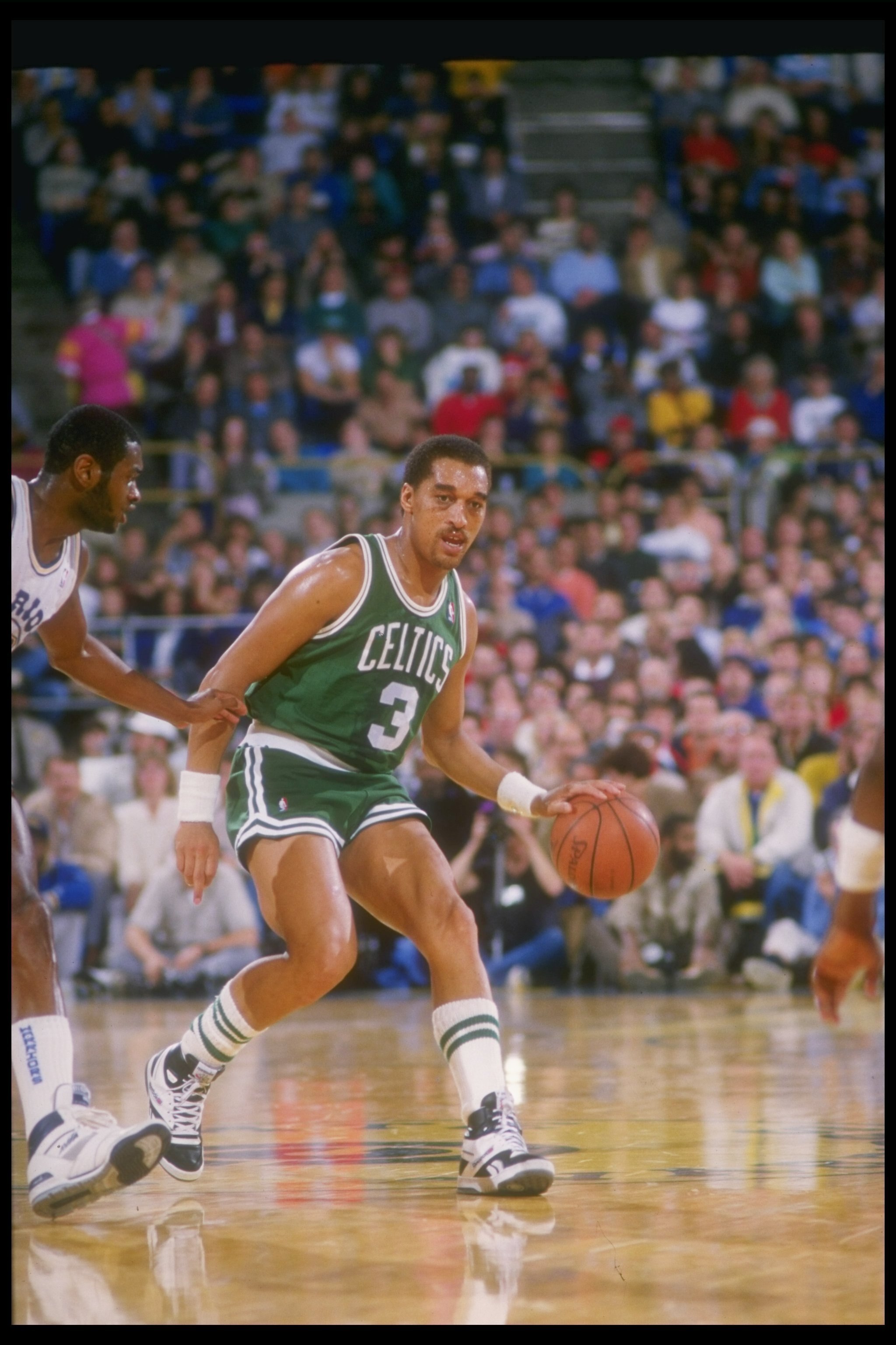 1987:  Guard Dennis Johnson of the Boston Celtics moves the ball during a game against the Golden State Warriors at the Coliseum Arena in Oakland, California. Mandatory Credit: Otto Greule Jr.  /Allsport