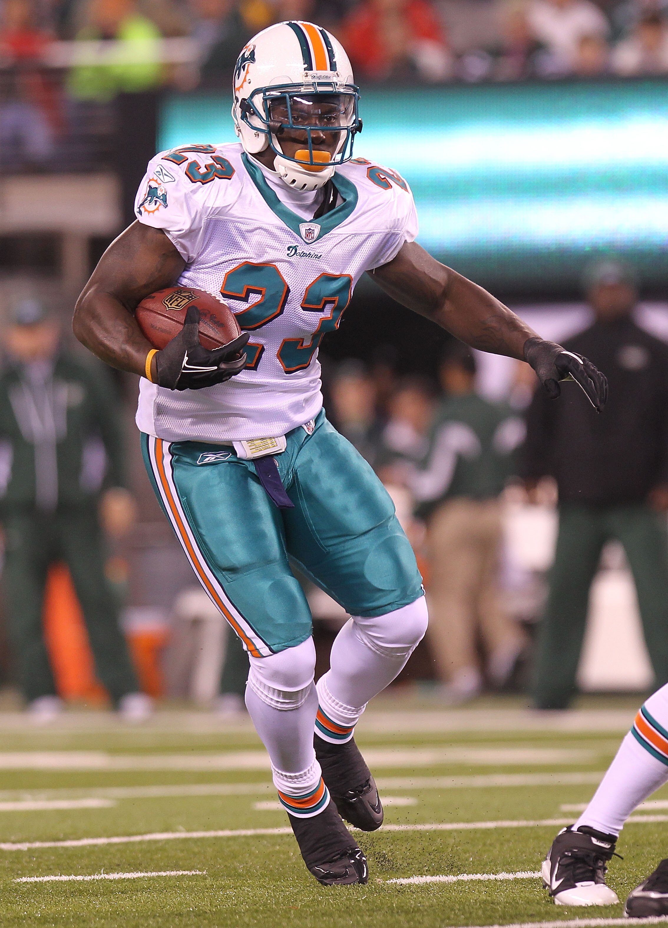 EAST RUTHERFORD, NJ - DECEMBER 12:  Ronnie Brown #23 of the Miami Dolphins rushes against the New York Jets at New Meadowlands Stadium on December 12, 2010 in East Rutherford, New Jersey.  (Photo by Nick Laham/Getty Images)