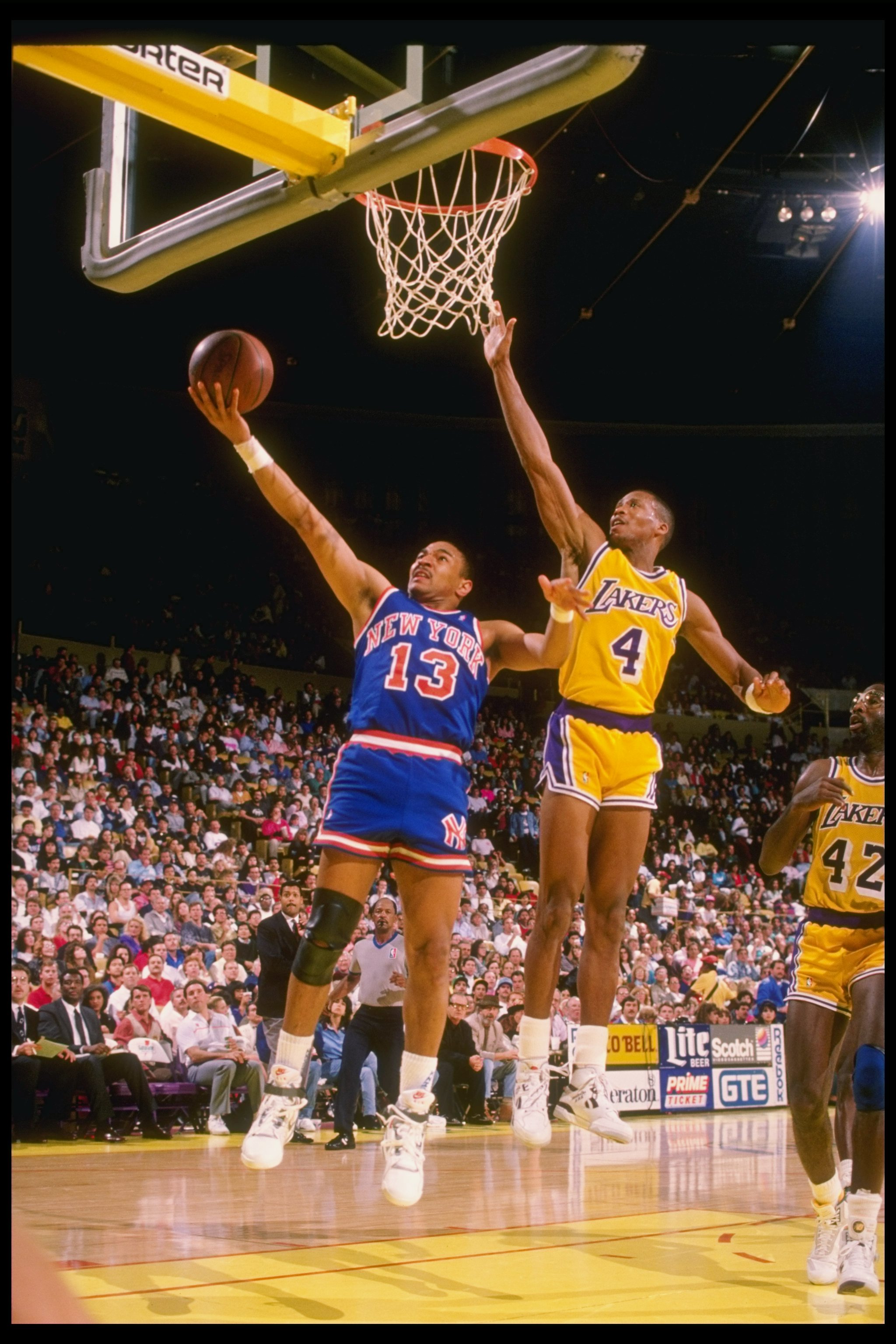1989-1990:  Guard Mark Jackson of the New York Knicks goes up for two as guard Byron Scott of the Los Angeles Lakers tries to block during a game at the Great Western Forum in Inglewood, California. Mandatory Credit: Mike Powell  /Allsport