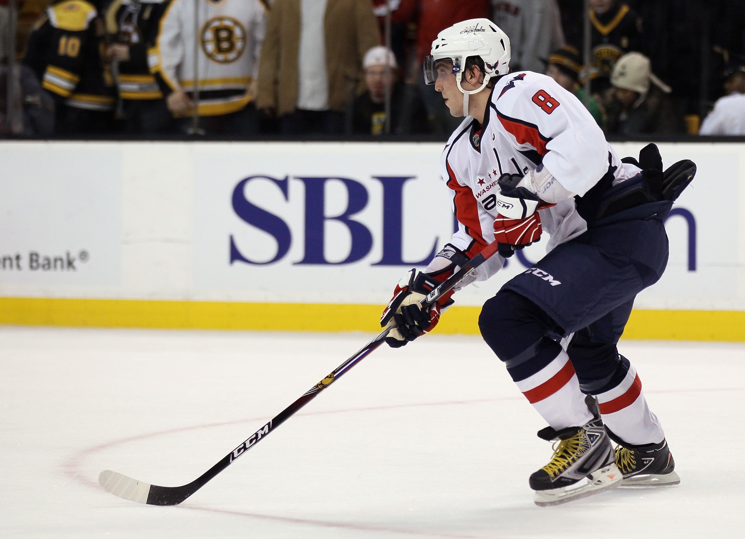 BOSTON, MA - DECEMBER 18:  Alex Ovechkin #8 of the Washington Capitals takes the puck in the third period against Boston Bruins the on December 18, 2010 at the TD Garden in Boston, Massachusetts. The Bruins defeated the Capitals 3-2.  (Photo by Elsa/Getty