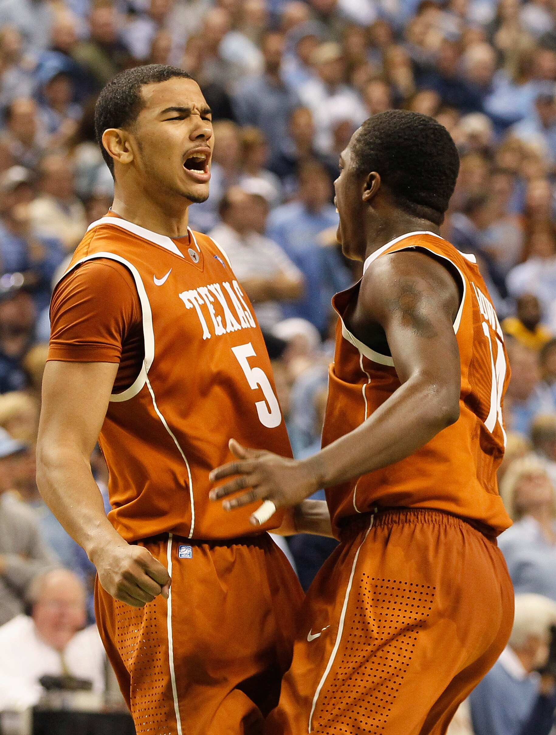 GREENSBORO, NC - DECEMBER 18:  Cory Joseph #5 of the Texas Longhorns reacts with J'Covan Brown #14 after Joseph hit what became the game-winning basket against the North Carolina Tar Heels Greensboro Coliseum on December 18, 2010 in Greensboro, North Caro