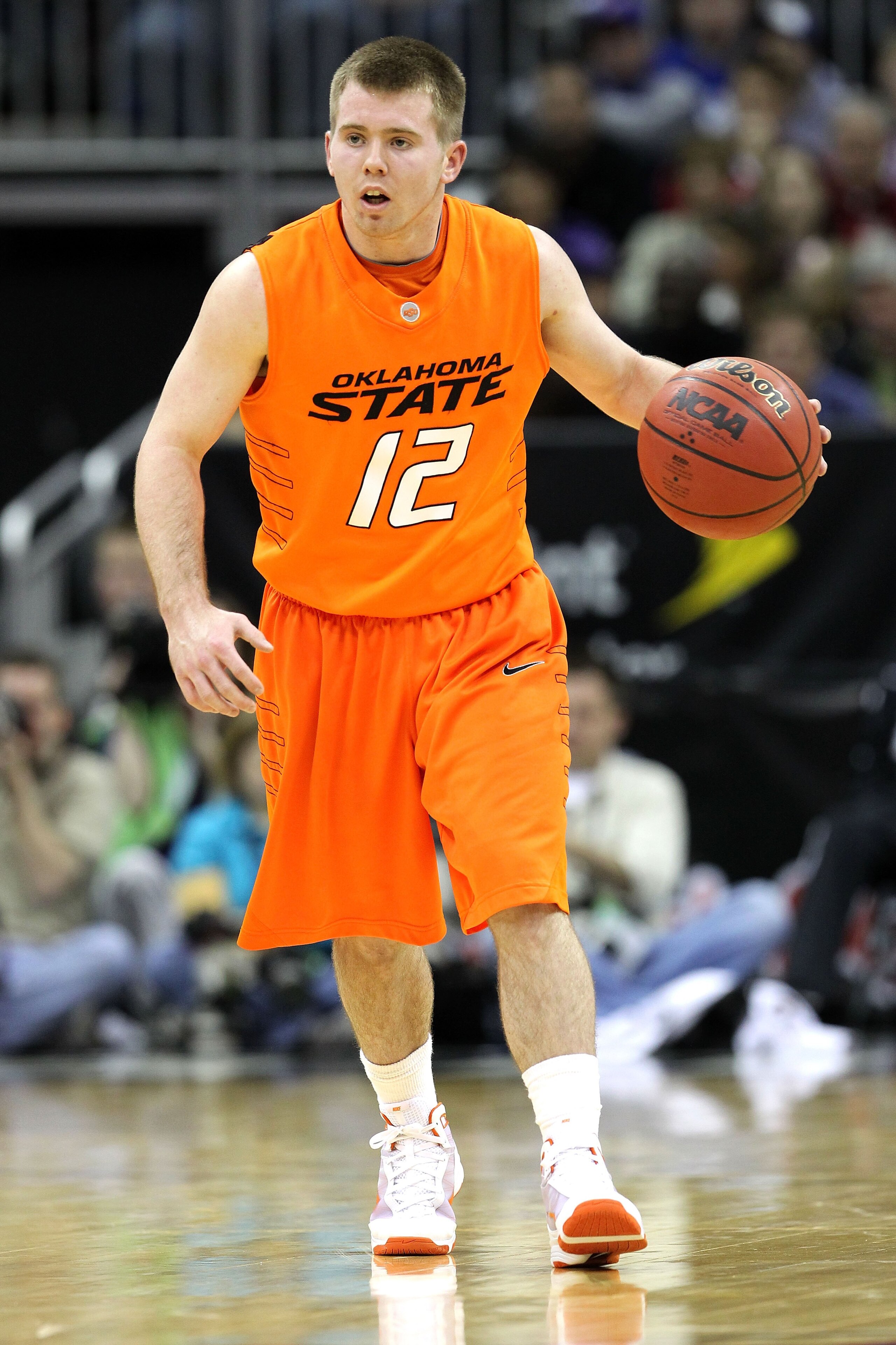KANSAS CITY, MO - MARCH 11: Keiton Page #12 of the Oklahoma State Cowboys moves the ball while taking on the Kansas State Wildcats during the quarterfinals of the 2010 Phillips 66 Big 12 Men's Basketball Tournament at the Sprint Center on March 11, 2010 KANSAS CITY, MO - MARCH 11: Keiton Page #12 of the Oklahoma State Cowboys moves the ball while taking on the Kansas State Wildcats during the quarterfinals of the 2010 Phillips 66 Big 12 Men's Basketball Tournament at the Sprint Center on March 11, 2010