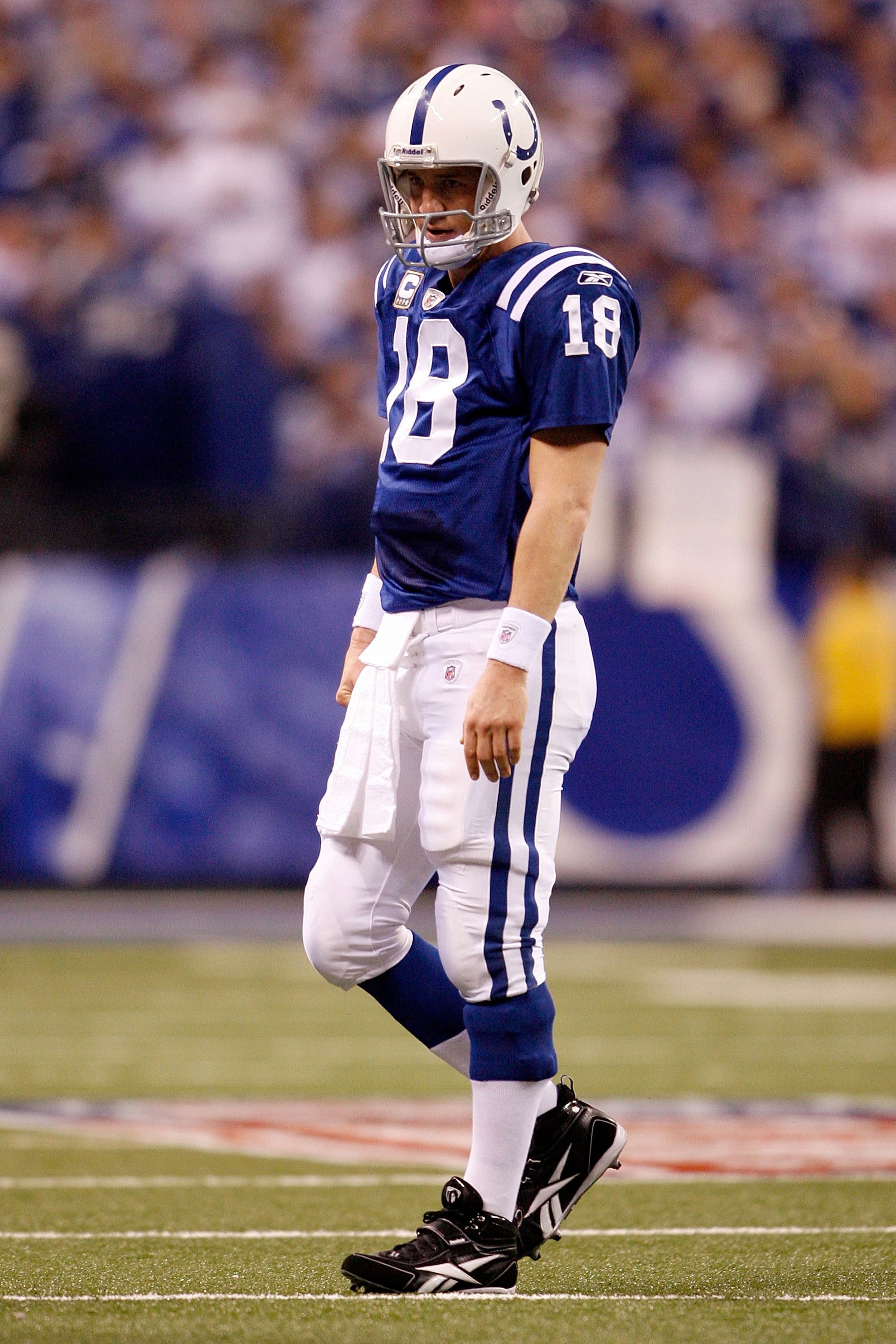 INDIANAPOLIS - JANUARY 16: Quarterback Peyton Manning #18 of the Indianapolis Colts looks on against the Baltimore Ravens during the AFC Divisional Playoff Game at Lucas Oli Stadium on January 16, 2010 in Indianapolis, Indiana. (Photo by Andy Lyons/Gett INDIANAPOLIS - JANUARY 16: Quarterback Peyton Manning #18 of the Indianapolis Colts looks on against the Baltimore Ravens during the AFC Divisional Playoff Game at Lucas Oli Stadium on January 16, 2010 in Indianapolis, Indiana. (Photo by Andy Lyons/Gett