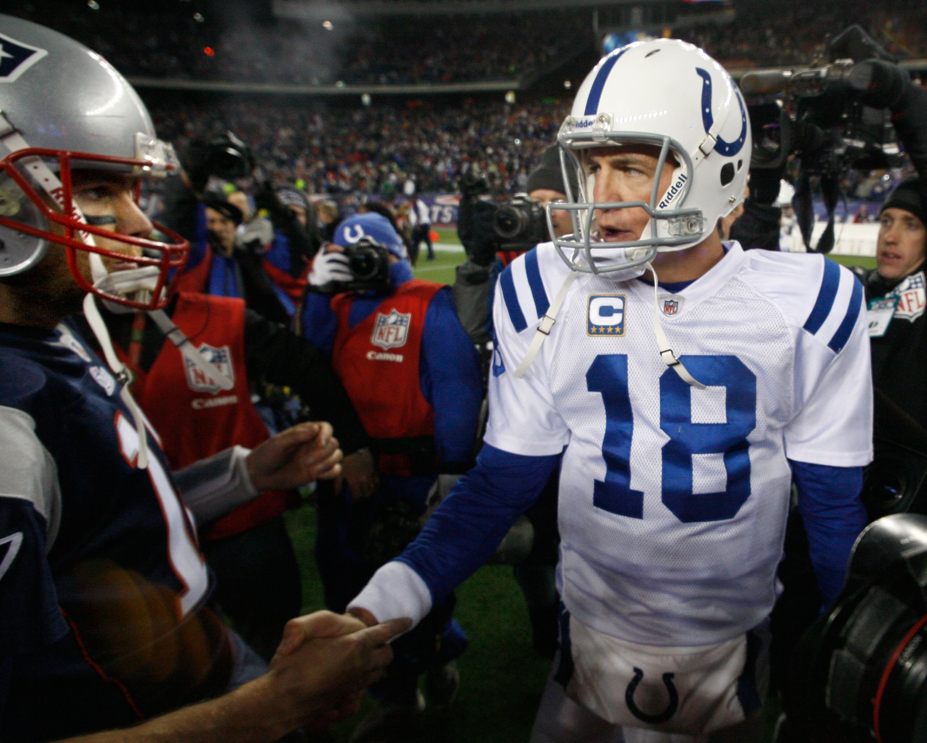FOXBORO, MA - NOVEMBER 21:  Tom Brady #12 of the New England Patriots shakes hands with Peyton Manning #18 of the Indianapolis Colts after their game at Gillette Stadium on November 21, 2010 in Foxboro, Massachusetts. (Photo by Jim Rogash/Getty Images)