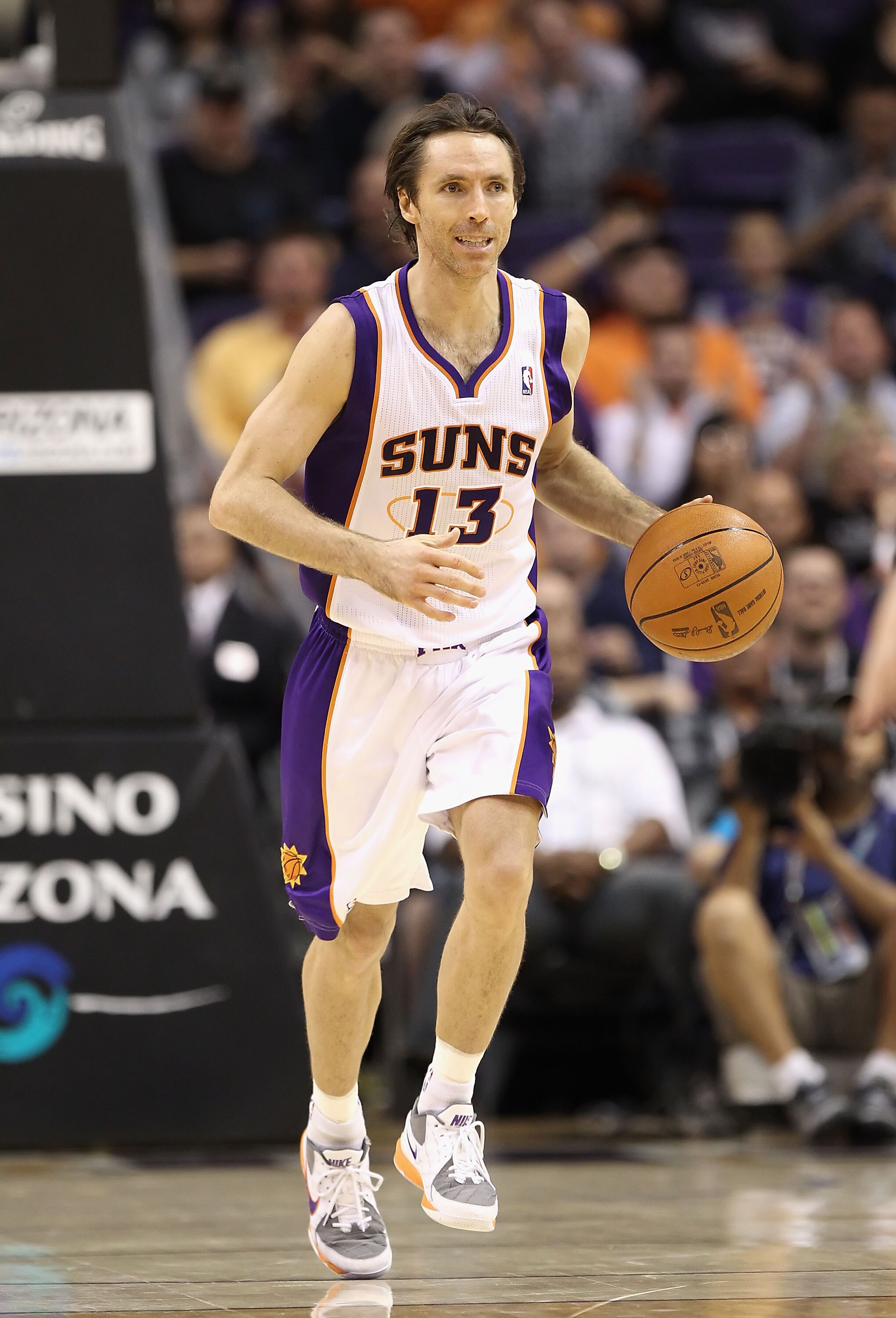 PHOENIX - DECEMBER 15:  Steve Nash #13 of the Phoenix Suns moves the ball upcourt during the NBA game against the Minnesota Timberwolves at US Airways Center on December 15, 2010 in Phoenix, Arizona.  The Suns defeated the Timberwolves 128-122.  NOTE TO U