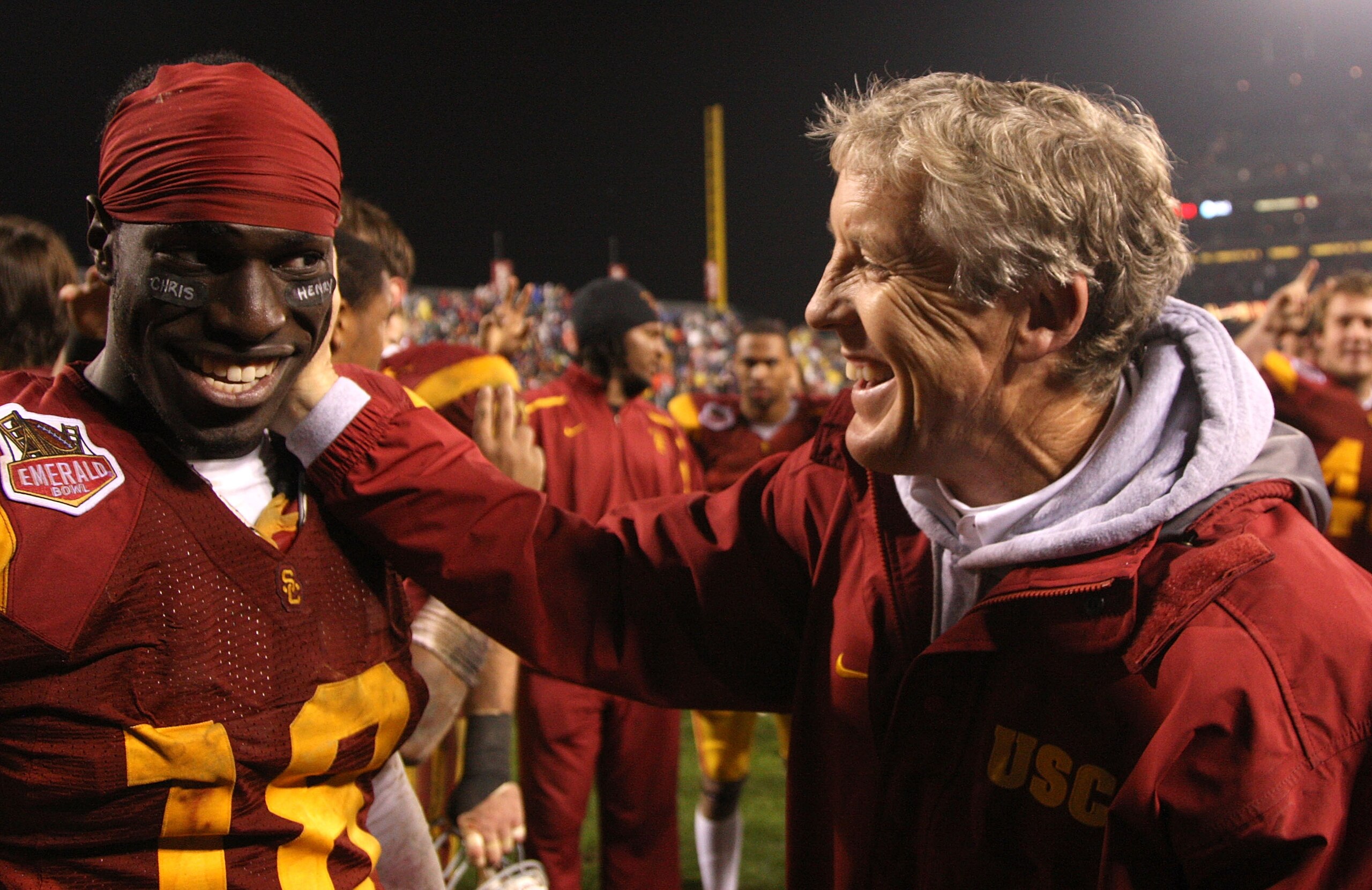 SAN FRANCISCO - DECEMBER 26: Head coach Pete Carroll and Damian Williams #18 of the USC Trojans celebrate after defeating the Boston College Eagles during the 2009 Emerald Bowl at AT&T Park on December 26, 2009 in San Francisco, California. (Photo by Jed