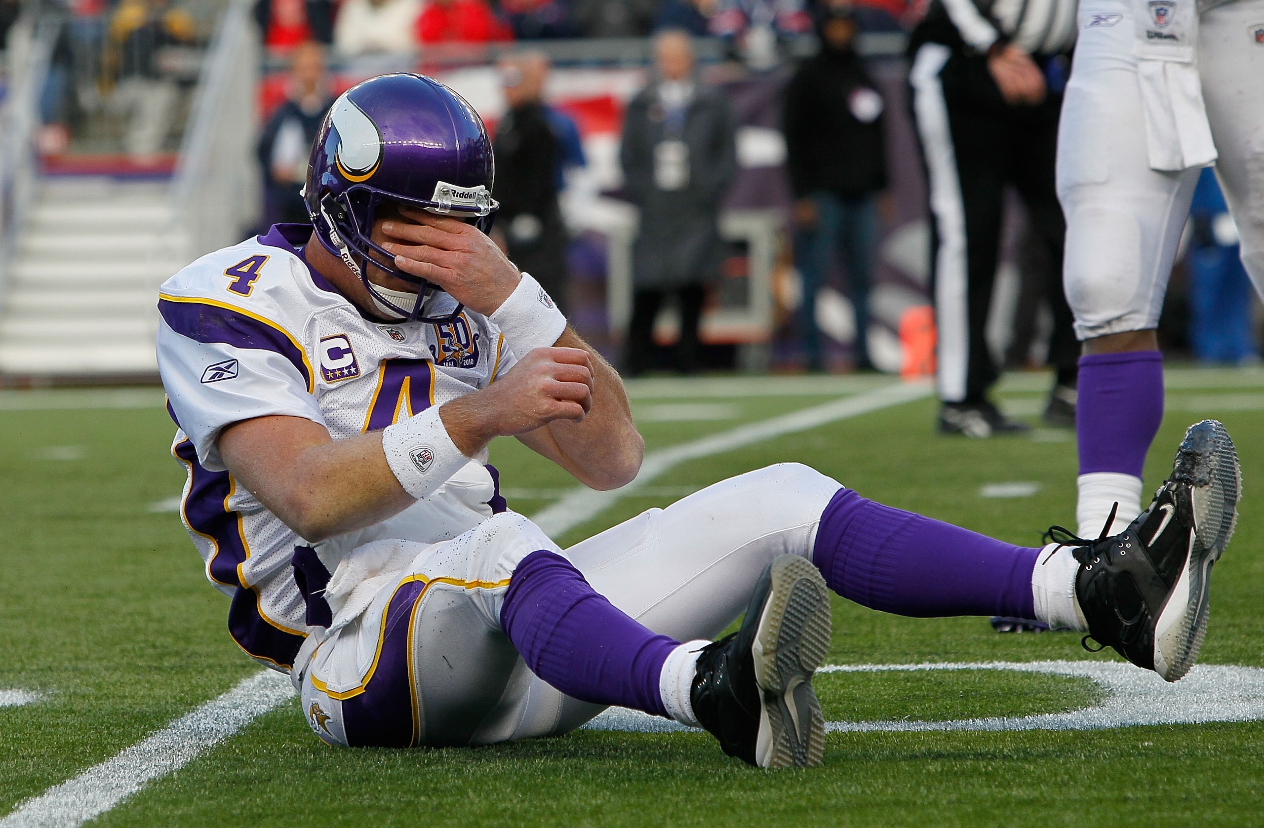 FOXBORO, MA - OCTOBER 31:  Brett Favre #4 of the Minnesota Vikings reacts after being knocked down in the first half against the New England Patriots at Gillette Stadium on October 31, 2010 in Foxboro, Massachusetts. (Photo by Jim Rogash/Getty Images)