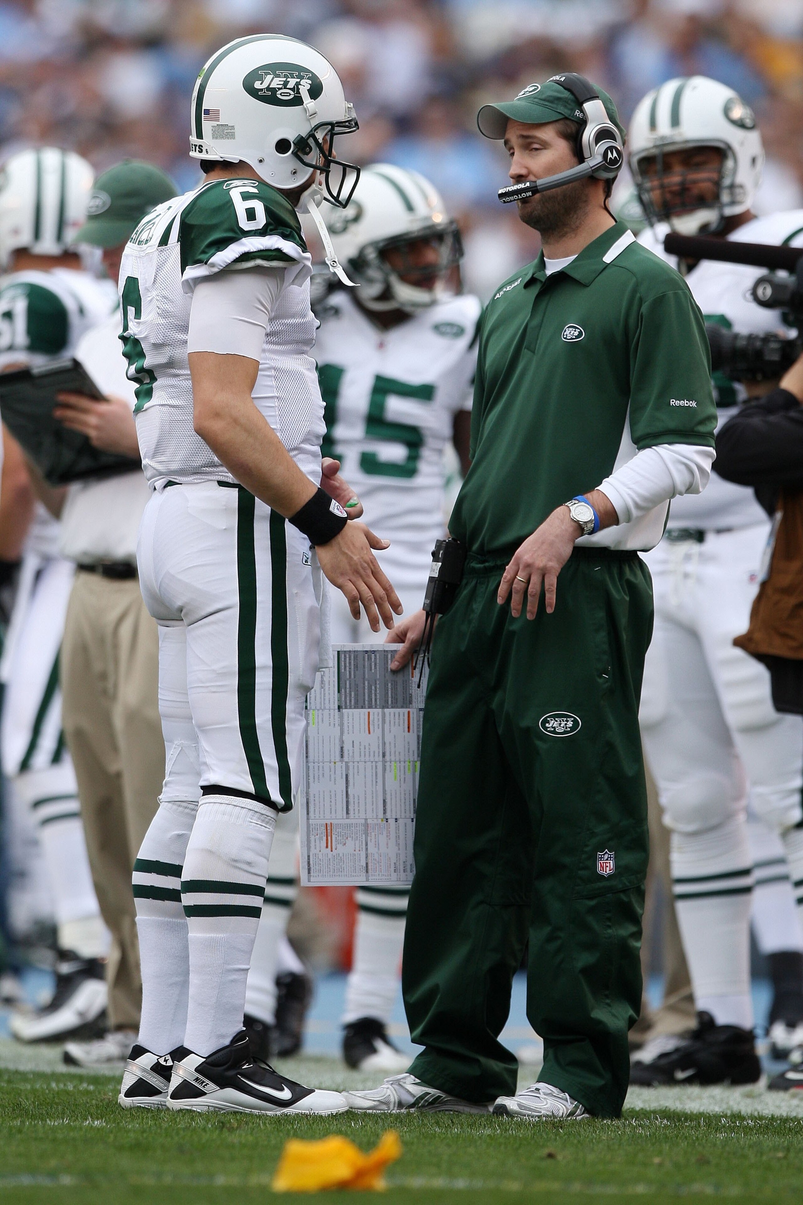 SAN DIEGO - JANUARY 17:  Quarterback Mark Sanchez #6 of the New York Jets speaks with offensive coordinator Brian Schottenheimer during the AFC Divisional Playoff Game against the San Diego Chargers at Qualcomm Stadium on January 17, 2010 in San Diego, Ca