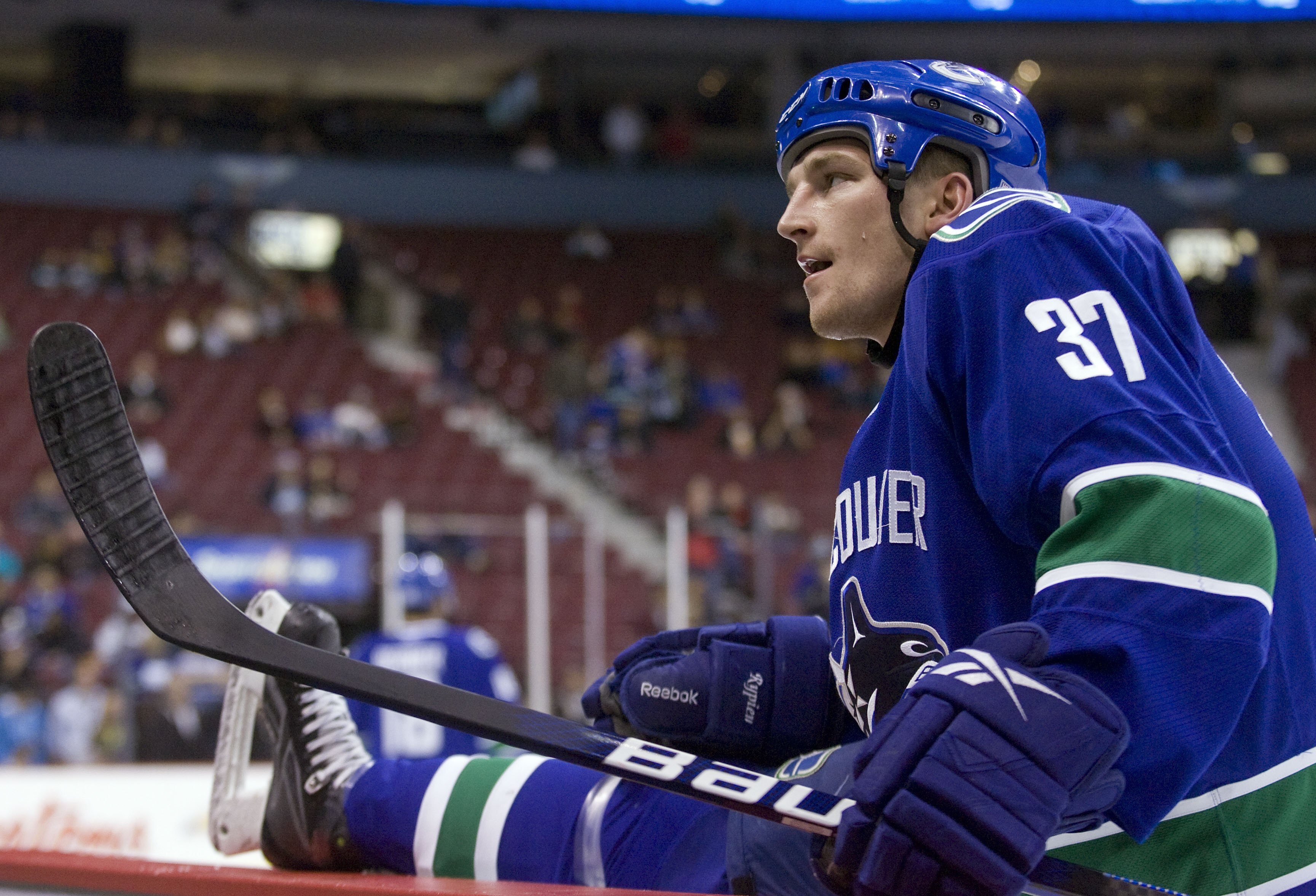 VANCOUVER, CANADA - OCTOBER 17: Rick Rypien #37 of the Vancouver Canucks stretches during the pre game warmup prior to the NHL game against the Minnesota Wild on October 17, 2009 at General Motors Place in Vancouver, British Columbia, Canada.  (Photo by R