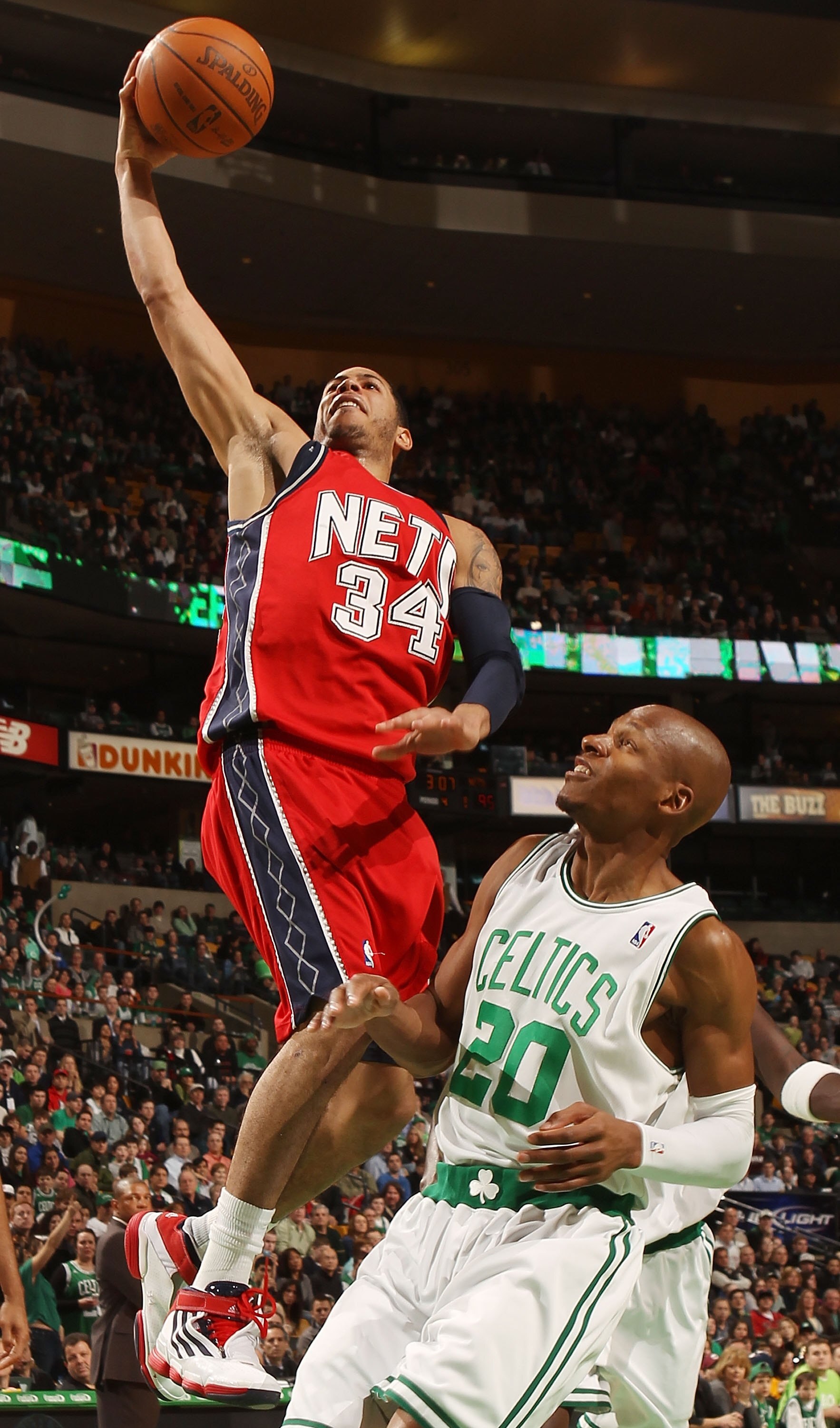 BOSTON - FEBRUARY 27:  Devin Harris #34 of the New Jersey Nets takes a shot as Ray Allen #20 of the Boston Celtics defends at the TD Garden on February 27, 2010 in Boston, Massachusetts. The Nets defeated the Celtics 104-96.  NOTE TO USER: User expressly 