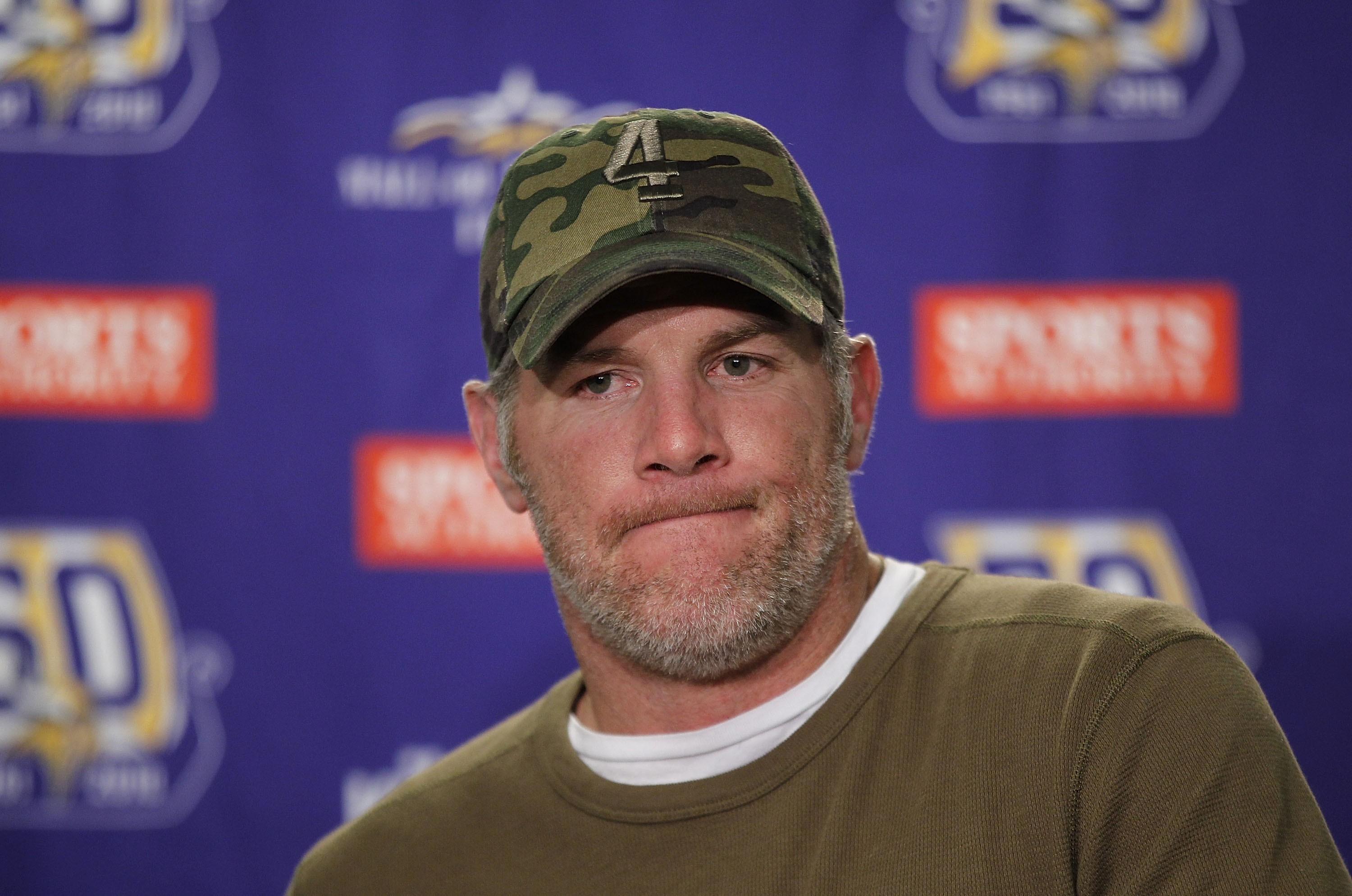 DETROIT, MI - DECEMBER 13:  Brett Favre #4 of the Minnesota Vikings talks to the media after the game against the New York Giants at Ford Field on December 13, 2010 in Detroit, Michigan. The Giants defeated the Vikings 21-3.  (Photo by Leon Halip/Getty Im