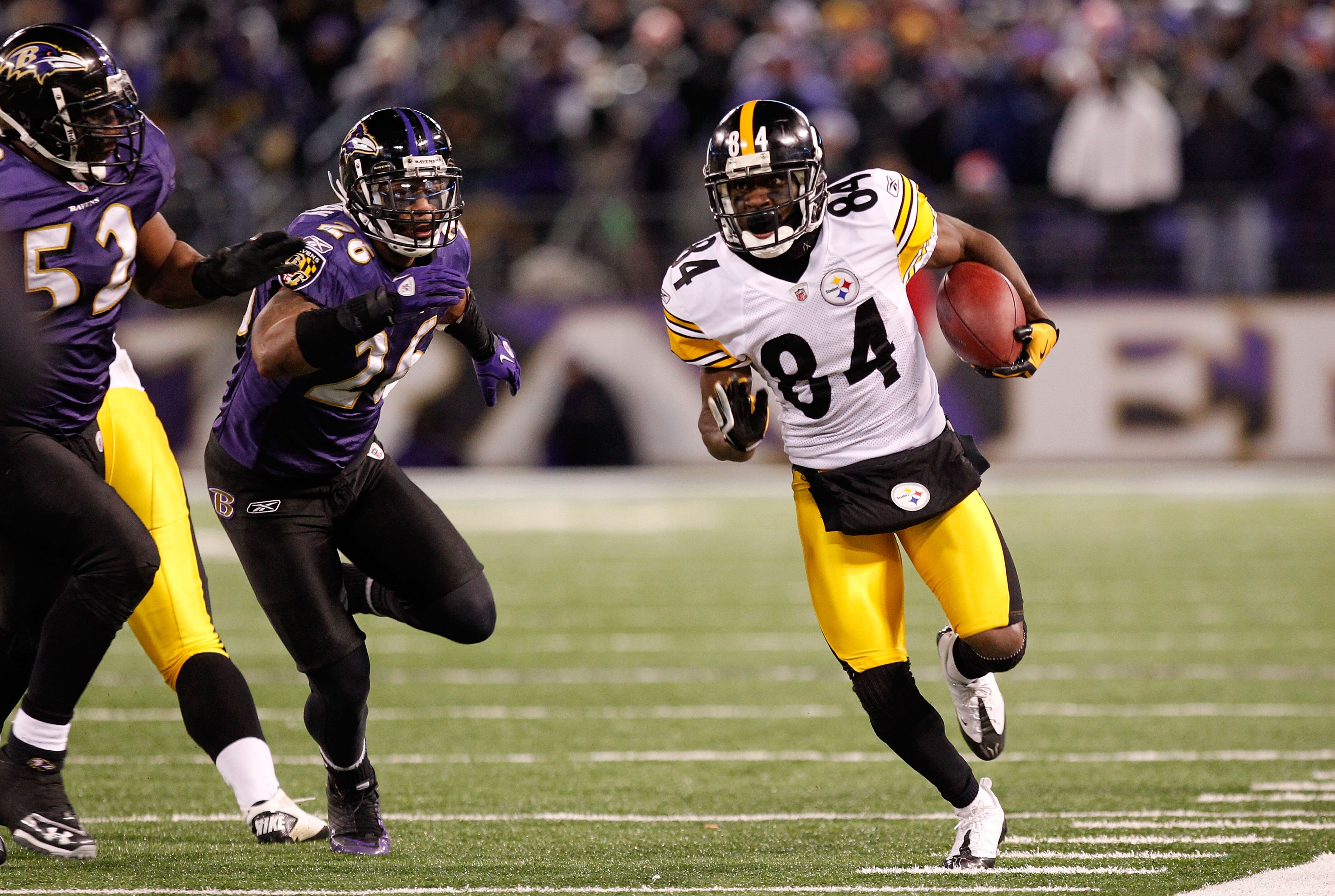 BALTIMORE, MD - DECEMBER 05:  Wide receiver Antonio Brown #84 of the Pittsburgh Steelers runs the ball against linebacker Ray Lewis #52 and safety Dawan Landry #26 of the Baltimore Ravens at M&T Bank Stadium on December 5, 2010 in Baltimore, Maryland.  Pi