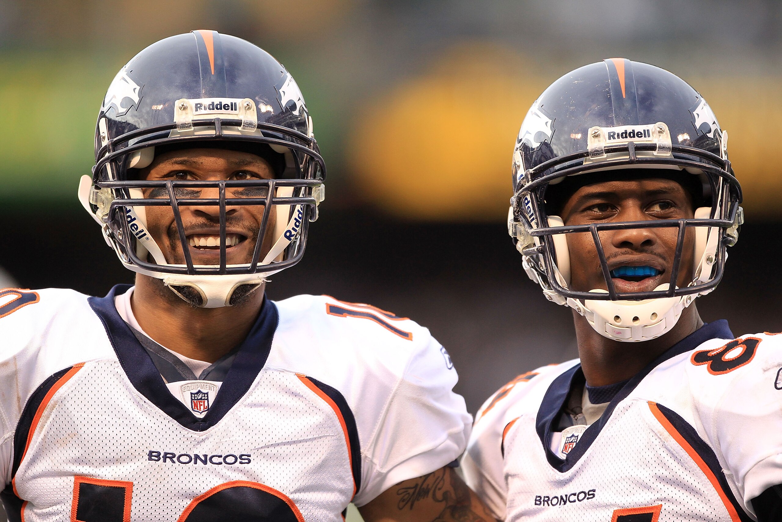OAKLAND, CA - DECEMBER 19:  Jabar Gaffney #10 (left) and Brandon Lloyd #84 of the Denver Broncos smile at the Raider fans during their game against the Oakland Raiders at Oakland-Alameda County Coliseum on December 19, 2010 in Oakland, California.  (Photo