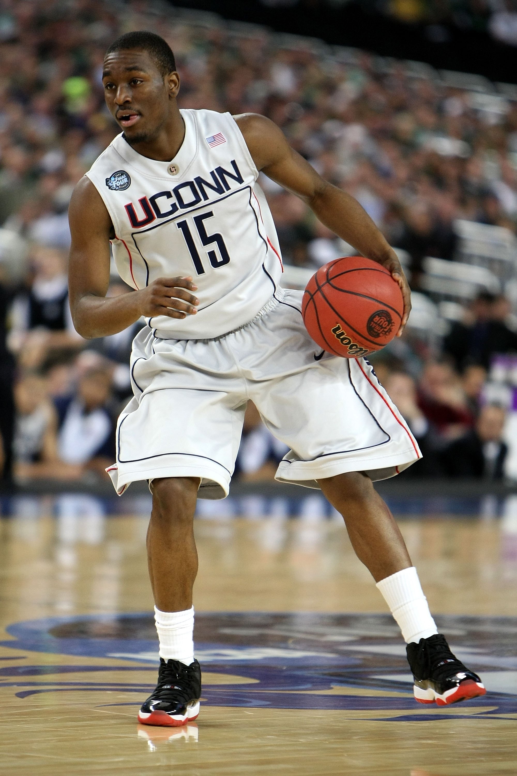 DETROIT - APRIL 04:  Kemba Walker #15 of the Connecticut Huskies moves the ball against the Michigan State Spartans during the National Semifinal game of the NCAA Division I Men's Basketball Championship at Ford Field on April 4, 2009 in Detroit, Michigan