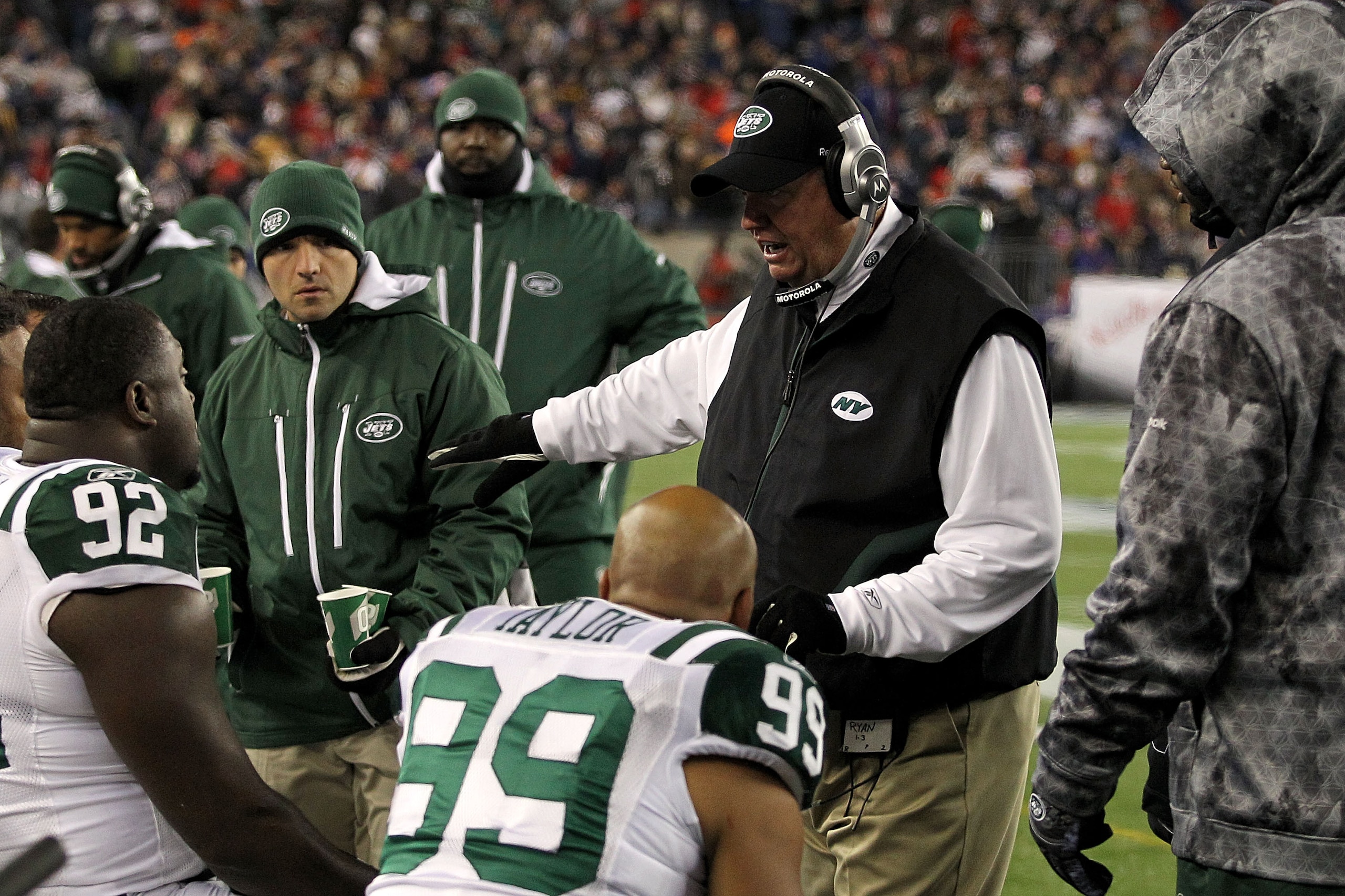 FOXBORO, MA - DECEMBER 06:  Head coach Rex Ryan of the New York Jets talks to his players on the bench during the first quarter against the New England Patriots at Gillette Stadium on December 6, 2010 in Foxboro, Massachusetts.  (Photo by Chris Chambers/G