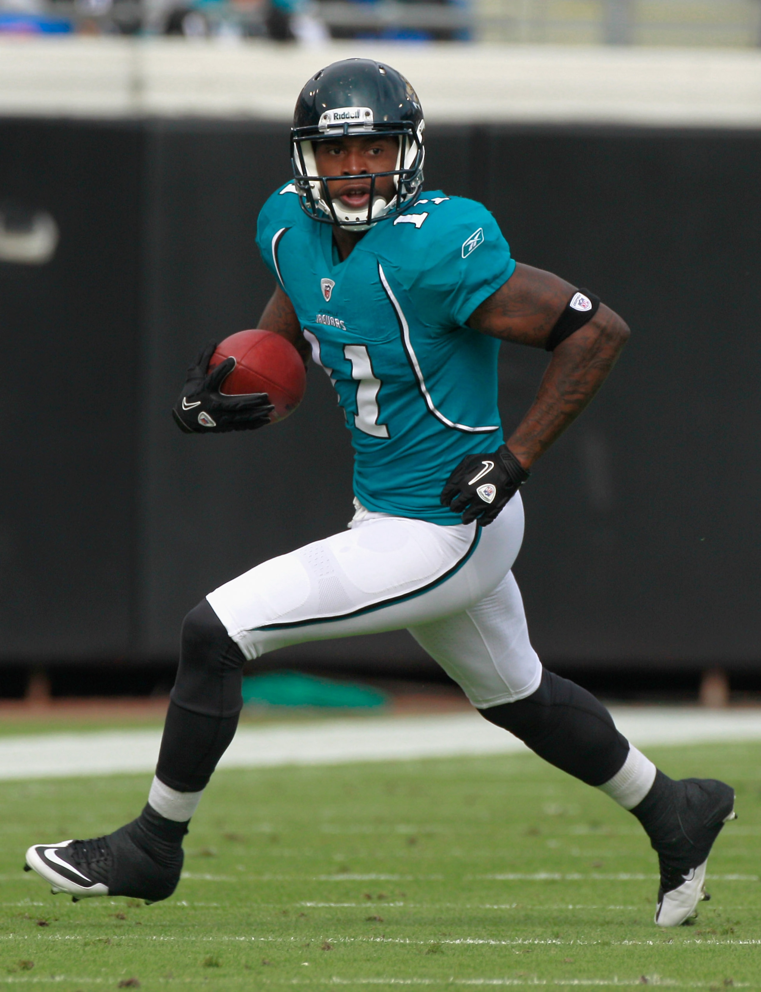JACKSONVILLE, FL - DECEMBER 12:  Mike Sims-Walker #11 of the Jacksonville Jaguars runs for yardage during the game against the Oakland Raiders at EverBank Field on December 12, 2010 in Jacksonville, Florida.  (Photo by Sam Greenwood/Getty Images)
