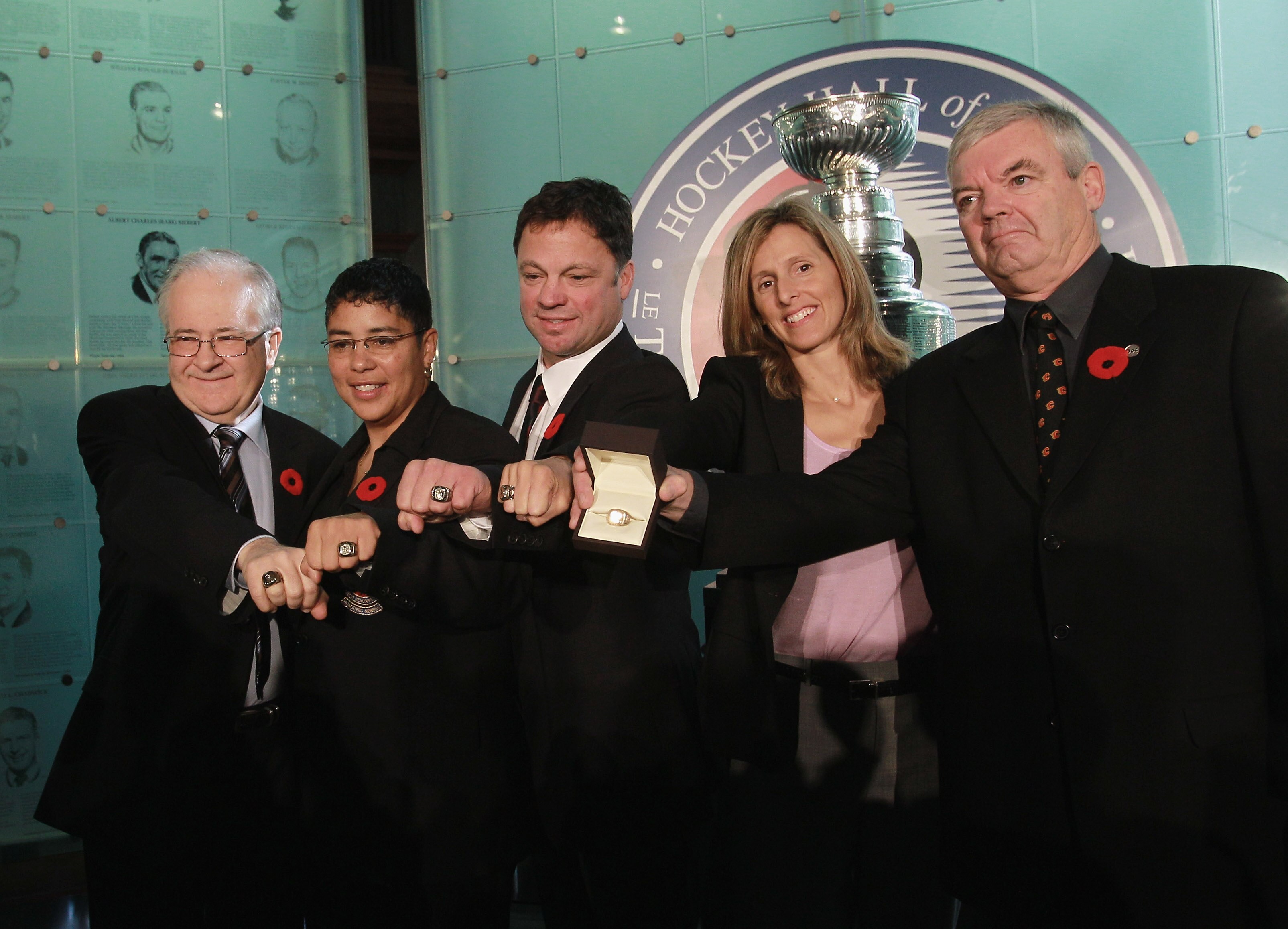TORONTO, ON - NOVEMBER 08:  (L-R) Jimmy Devellano, Angela James, Dino Ciccarelli, Cammi Granato, and Bob Seaman (representing Doc Seaman), appear at a media opportunity prior to their induction ceremony to the Hockey Hall of Fame on November 8, 2010 in To
