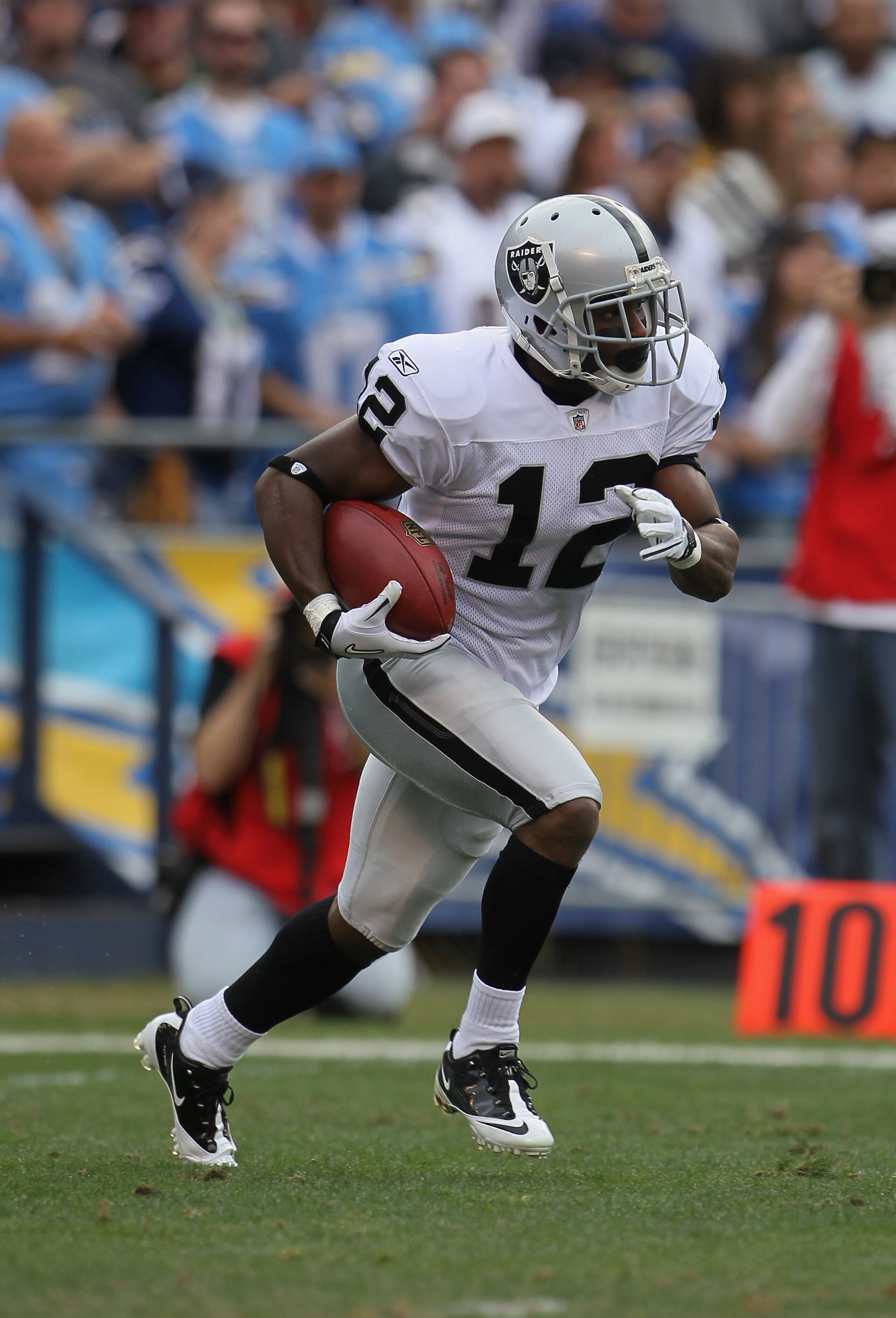 SAN DIEGO - DECEMBER 05:  Jacoby Ford #12 the Oakland Raiders carries the ball against the San Diego Chargers at Qualcomm Stadium on December 5, 2010 in San Diego, California. The Raiders defeated the Chargers 28-13.  (Photo by Jeff Gross/Getty Images)