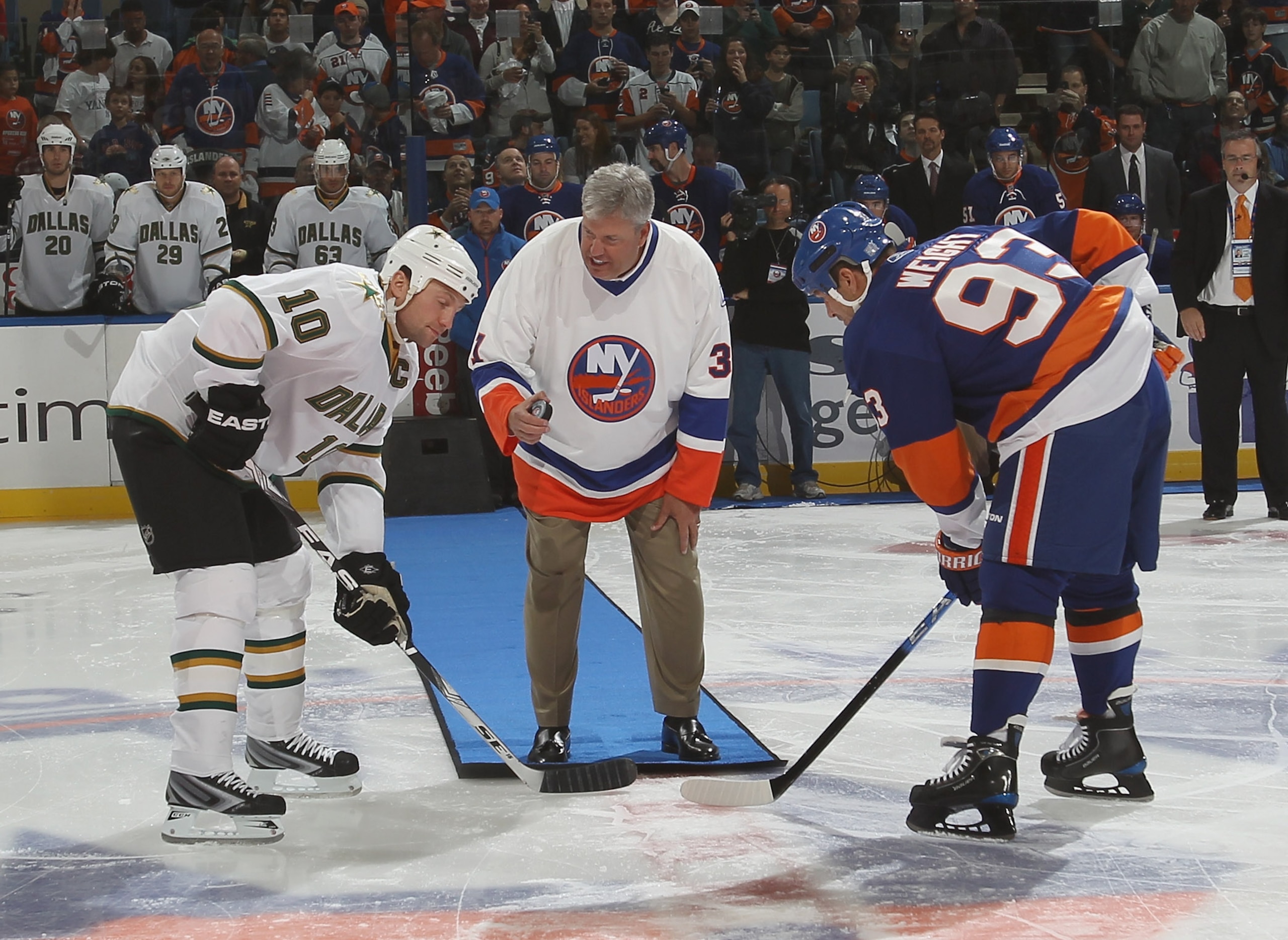 UNIONDALE, NY - OCTOBER 09:  New York Jets coach Rex Ryan drops the ceremonial puck between Brenden Morrow #10 of the Dallas Stars and Doug Weight #93 of the New York Islanders prior to the Islanders home opener at the Nassau Coliseum on October 9, 2010 i