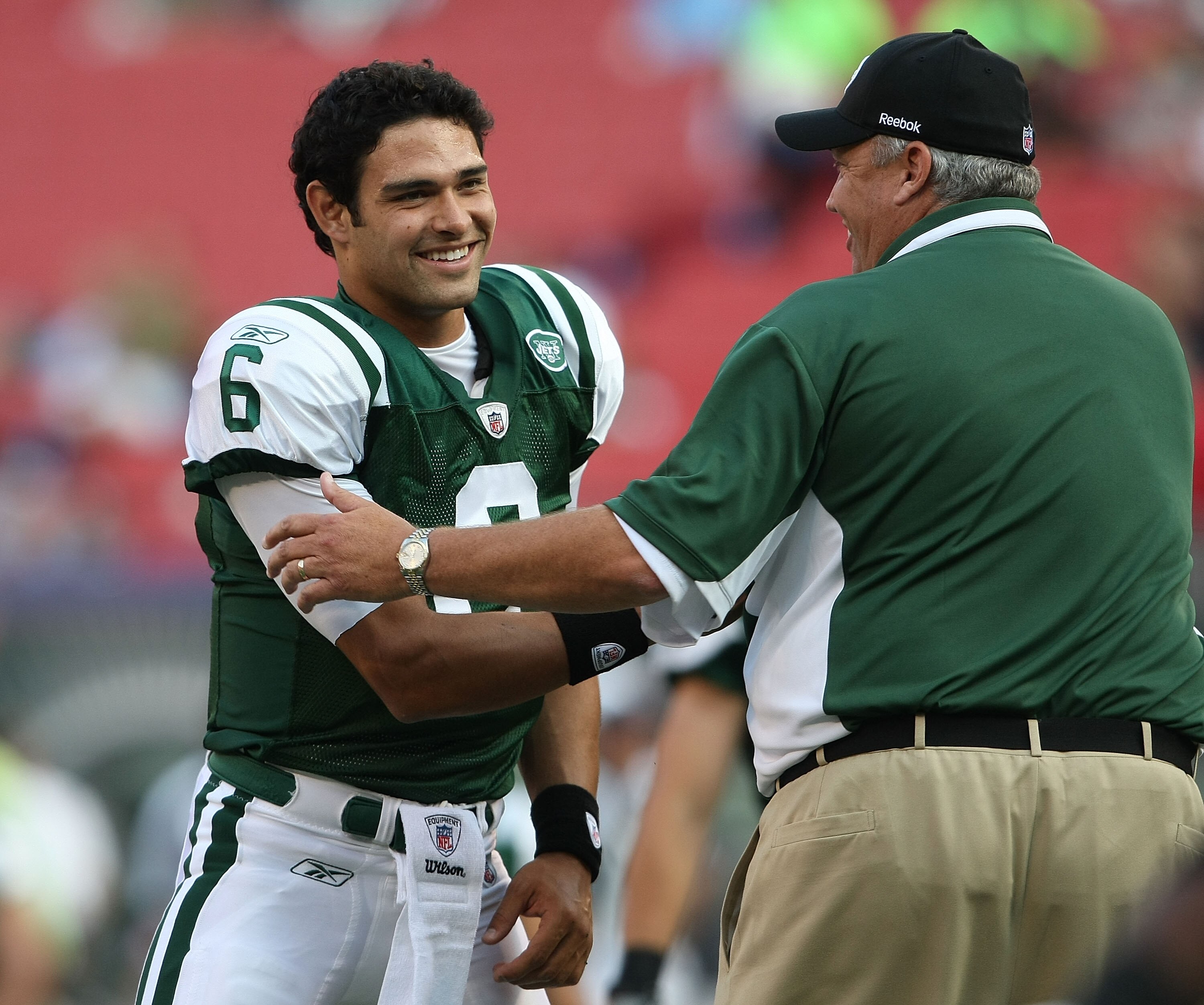 EAST RUTHERFORD, NJ - AUGUST 14:  Mark Sanchez #6 of the New York Jets shakes hands with head coach Rex Ryan prior to the preseason game against the St. Louis Rams at Giants Stadium on August 14, 2009  in East Rutherford, New Jersey.  (Photo by Nick Laham