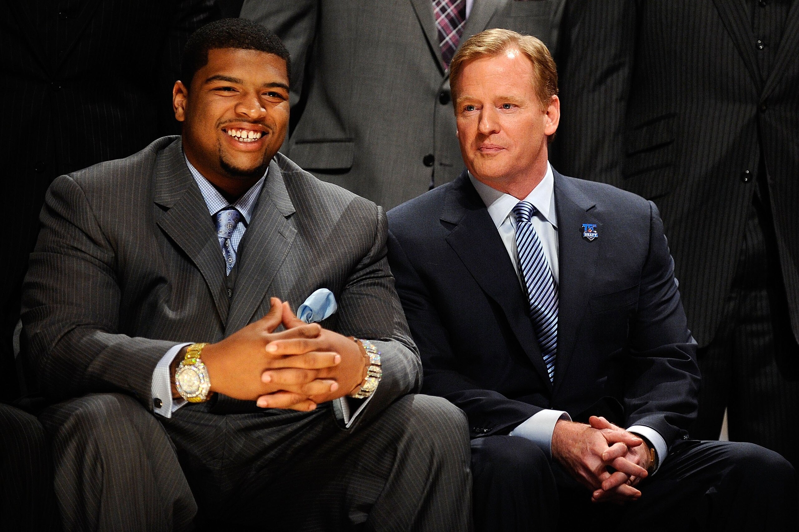 NEW YORK - APRIL 22:  Trent Williams from the Oklahoma Sooners (who was drafted #4 overall by the Washington Redskins) sits with NFL Commissioner Roger Goodell (R) during the first round of the 2010 NFL Draft at Radio City Music Hall on April 22, 2010 in