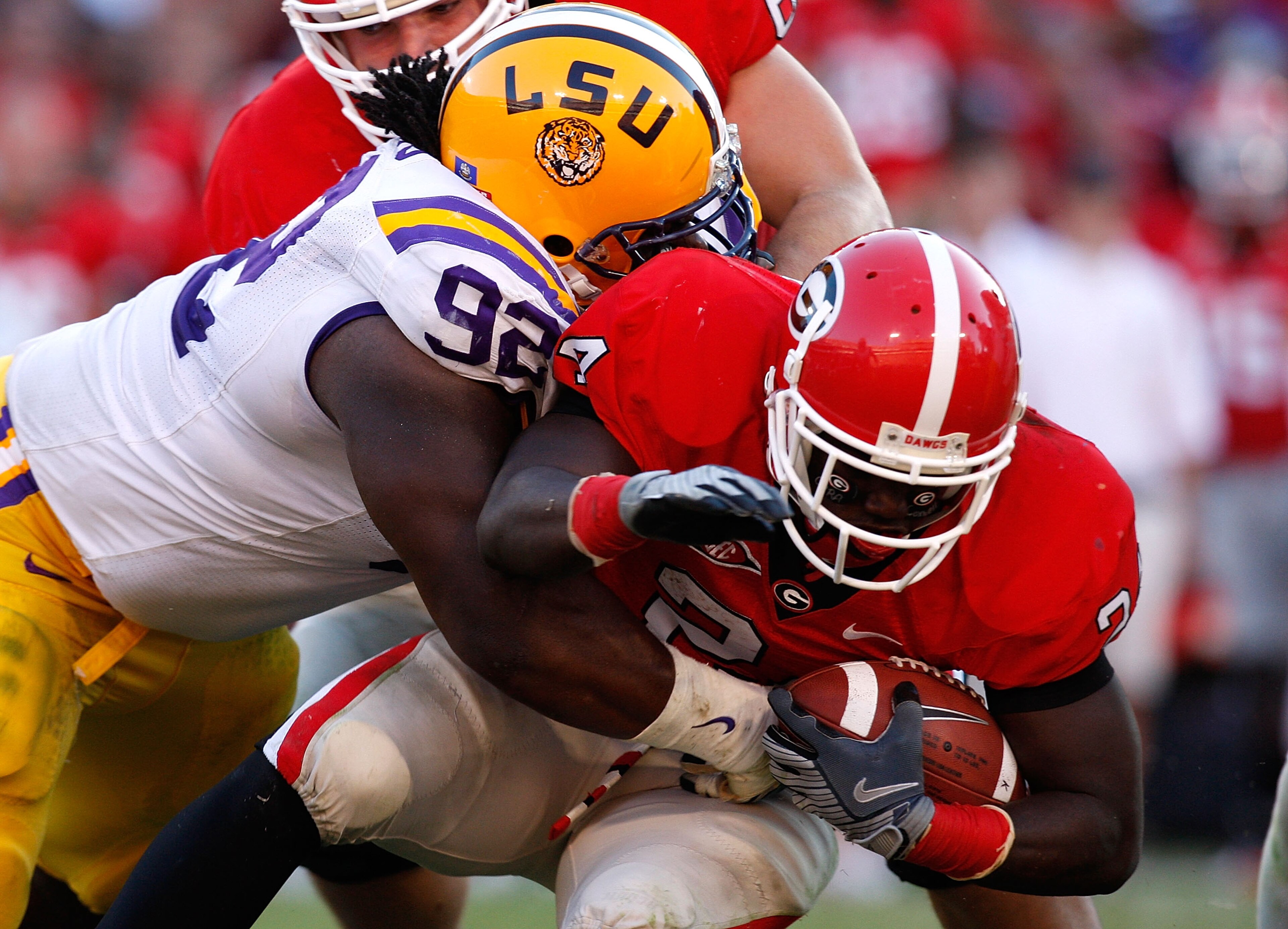 ATHENS, GA - OCTOBER 03: Drake Nevis #92 of the Louisiana State University Tigers tackles Washaun Ealey #24 of the Georgia Bulldogs at Sanford Stadium on October 3, 2009 in Athens, Georgia. (Photo by Kevin C. Cox/Getty Images) ATHENS, GA - OCTOBER 03: Drake Nevis #92 of the Louisiana State University Tigers tackles Washaun Ealey #24 of the Georgia Bulldogs at Sanford Stadium on October 3, 2009 in Athens, Georgia. (Photo by Kevin C. Cox/Getty Images)
