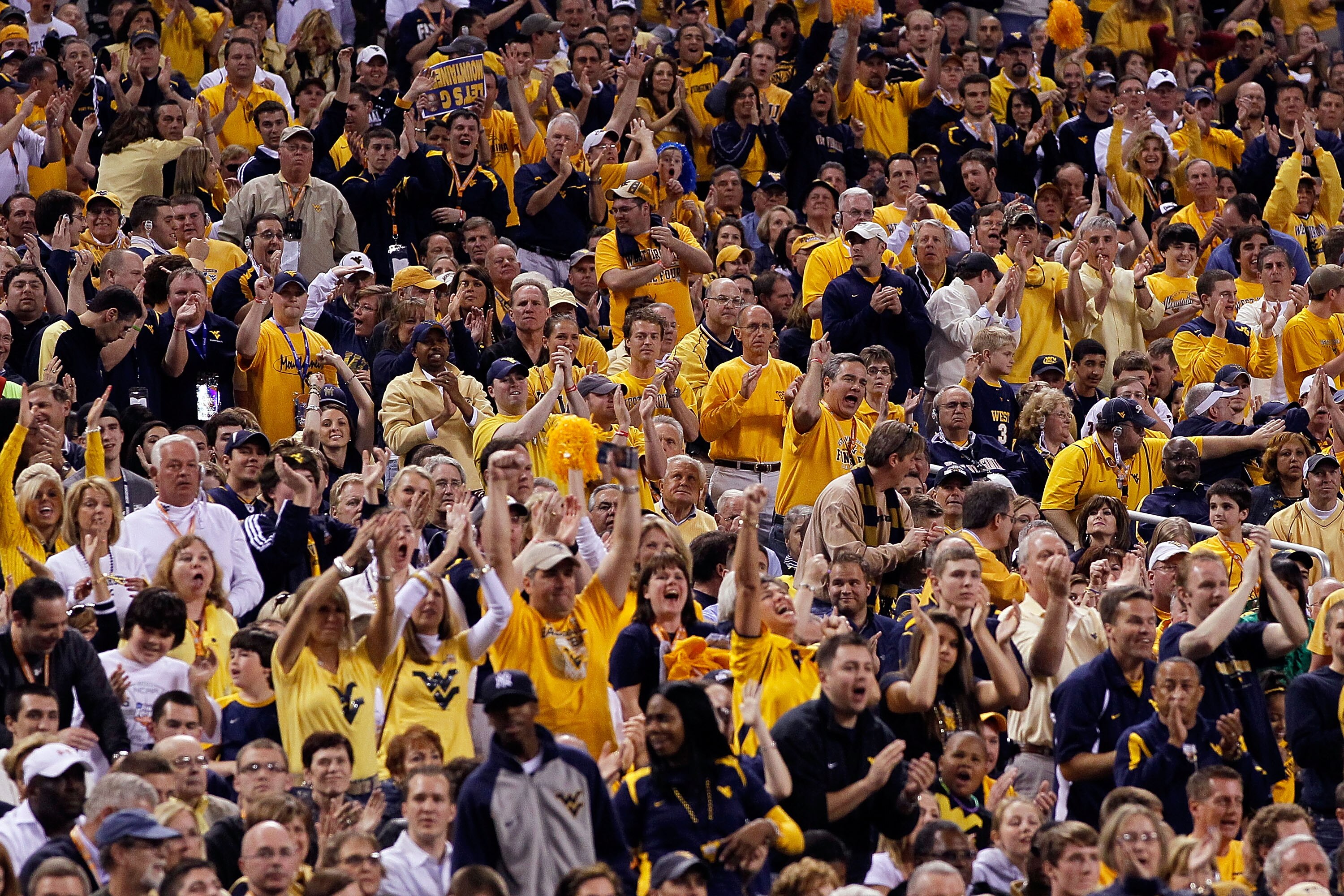 INDIANAPOLIS - APRIL 03:  Fans of the West Virginia Mountaineers cheer on their team in the first half against the Duke Blue Devils during the National Semifinal game of the 2010 NCAA Division I Men's Basketball Championship at Lucas Oil Stadium on April