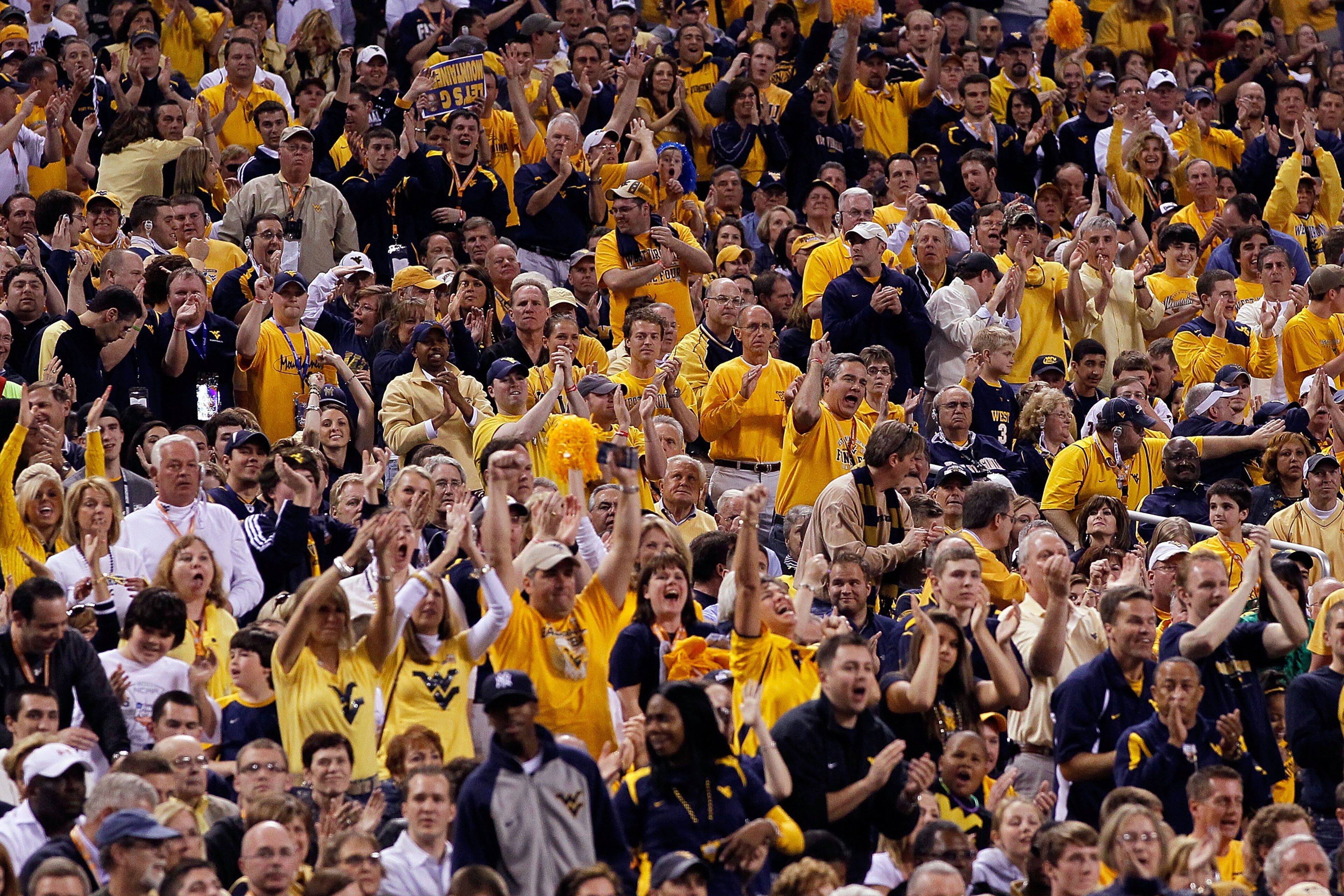 INDIANAPOLIS - APRIL 03: Fans of the West Virginia Mountaineers cheer on their team in the first half against the Duke Blue Devils during the National Semifinal game of the 2010 NCAA Division I Men's Basketball Championship at Lucas Oil Stadium on April INDIANAPOLIS - APRIL 03: Fans of the West Virginia Mountaineers cheer on their team in the first half against the Duke Blue Devils during the National Semifinal game of the 2010 NCAA Division I Men's Basketball Championship at Lucas Oil Stadium on April