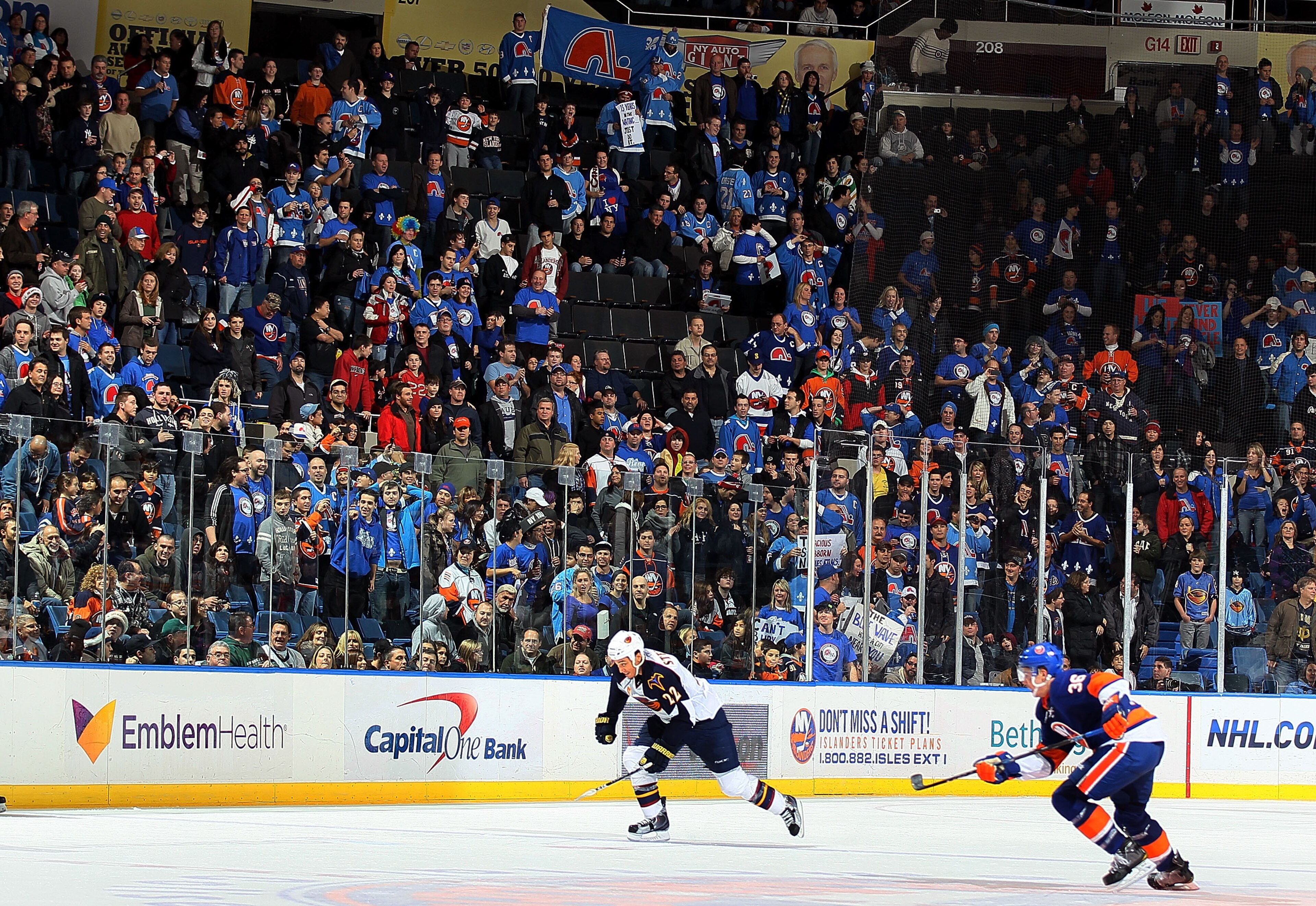UNIONDALE, NY - DECEMBER 11: Members of 'Nordiques Nation' watch the NHL game between the New York Islanders and the Atlanta Thrashers on December 11, 2010 at Nassau Coliseum in Uniondale, New York. Over 1,100 fans from Quebec attended the game to show UNIONDALE, NY - DECEMBER 11: Members of 'Nordiques Nation' watch the NHL game between the New York Islanders and the Atlanta Thrashers on December 11, 2010 at Nassau Coliseum in Uniondale, New York. Over 1,100 fans from Quebec attended the game to show