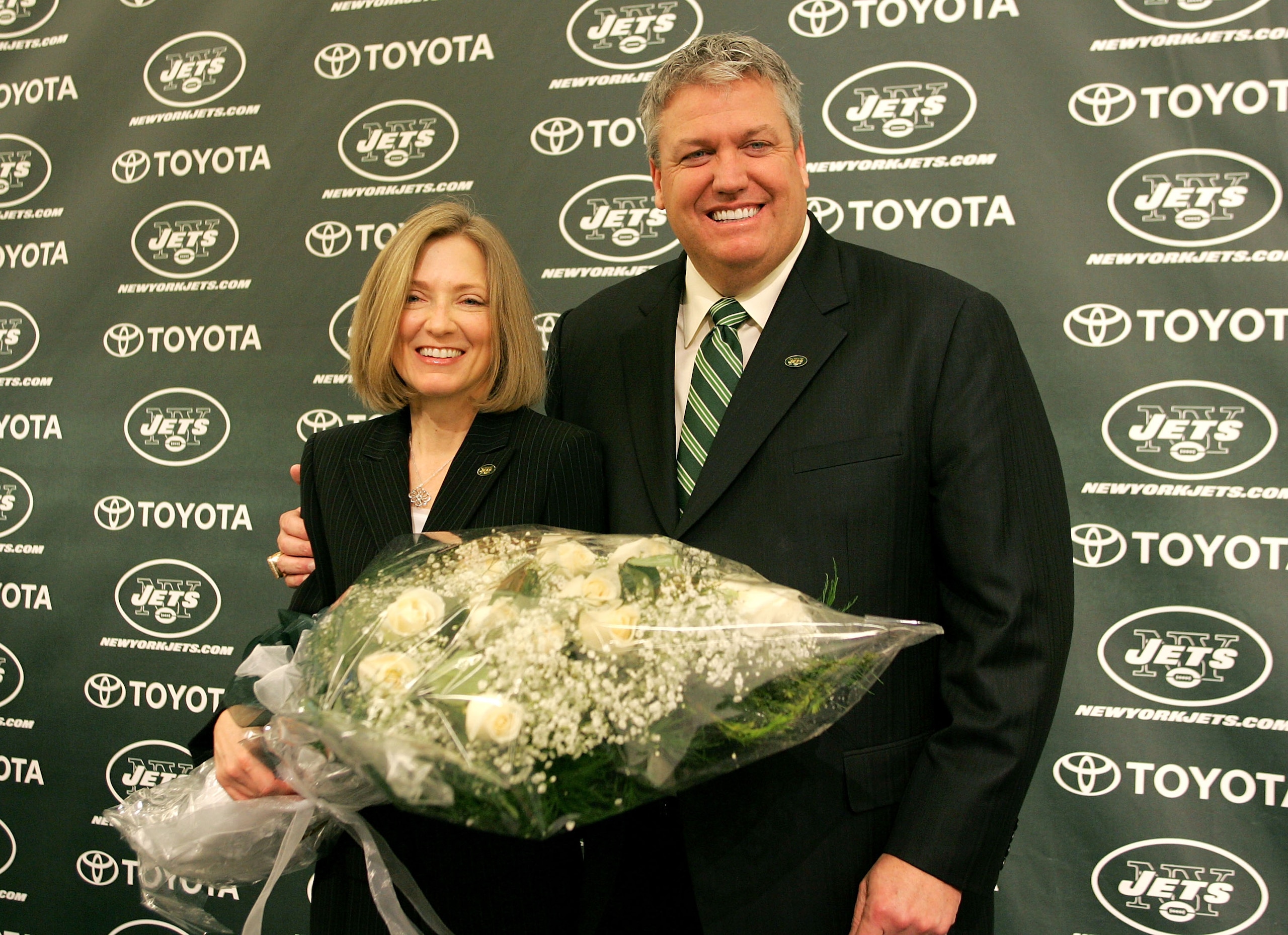 FLORHAM PARK, NJ - JANUARY 21: New York Jets Head Coach Rex Ryan and his wife Michelle Ryan pose for a photo during a press conference announcing Ryan as the new Head Coach of the New York Jets at the Atlantic Health Jets Training Center on January 21, 20