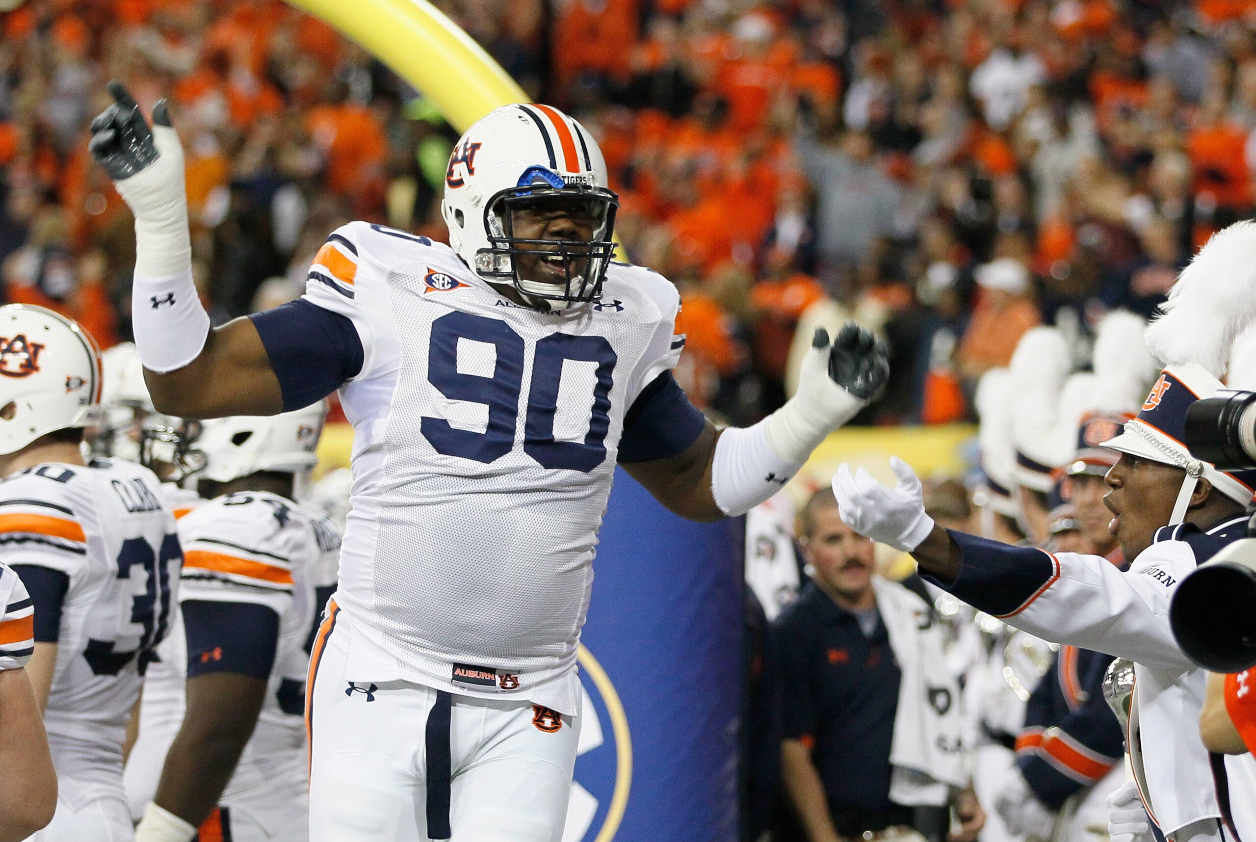 ATLANTA, GA - DECEMBER 04:  Nick Fairley #90 of the Auburn Tigers cheers during pregame warmups before facing the South Carolina Gamecocks during the 2010 SEC Championship at Georgia Dome on December 4, 2010 in Atlanta, Georgia.  (Photo by Kevin C. Cox/Ge