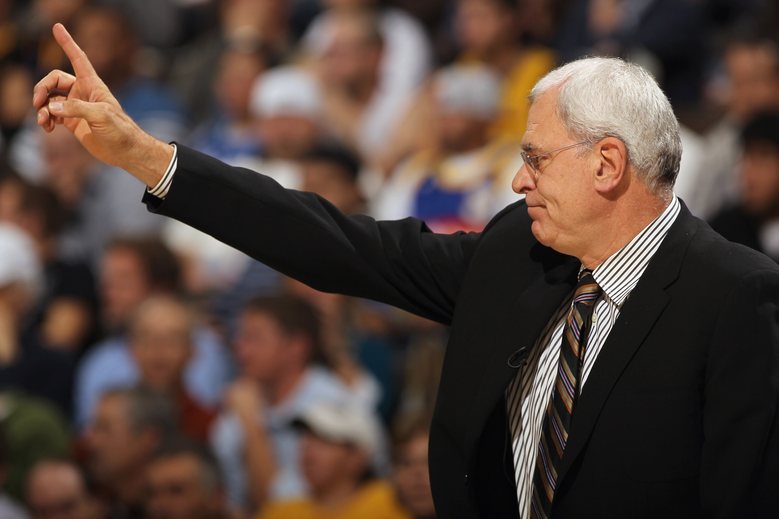 DENVER - NOVEMBER 11:  Head coach Phil Jackson of the Los Angeles Lakers directs his team against the Denver Nuggets at the Pepsi Center on November 11, 2010 in Denver, Colorado. The Nuggets defeated the Lakers 118-112.  NOTE TO USER: User expressly ackno