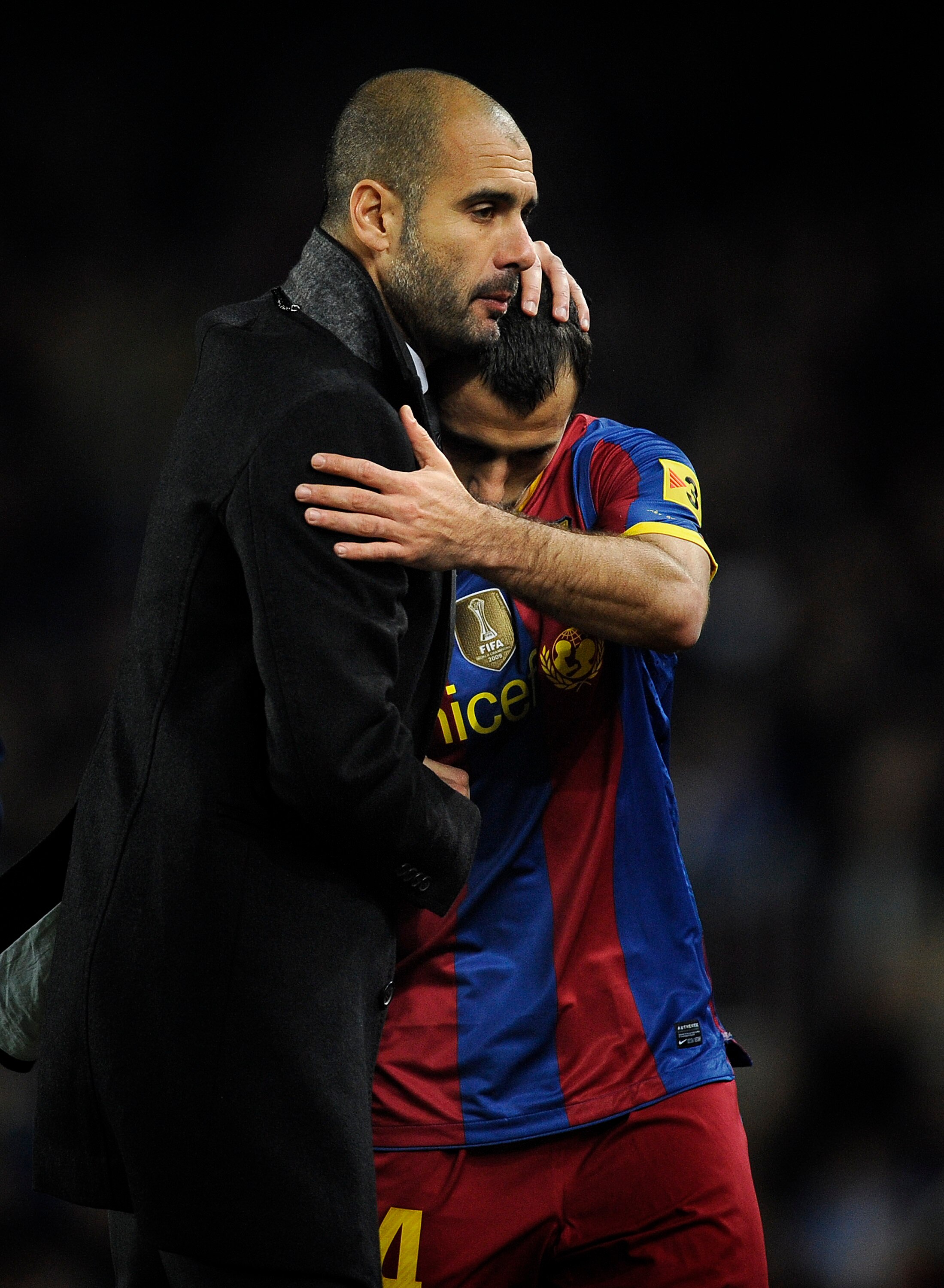 BARCELONA, SPAIN - DECEMBER 12:  Head coach Josep Guardiola of Barcelona (L) and Javier Mascherano hug each other during the La Liga match between Barcelona and Real Sociedad at Camp Nou Stadium on December 12, 2010 in Barcelona, Spain. Barcelona won the
