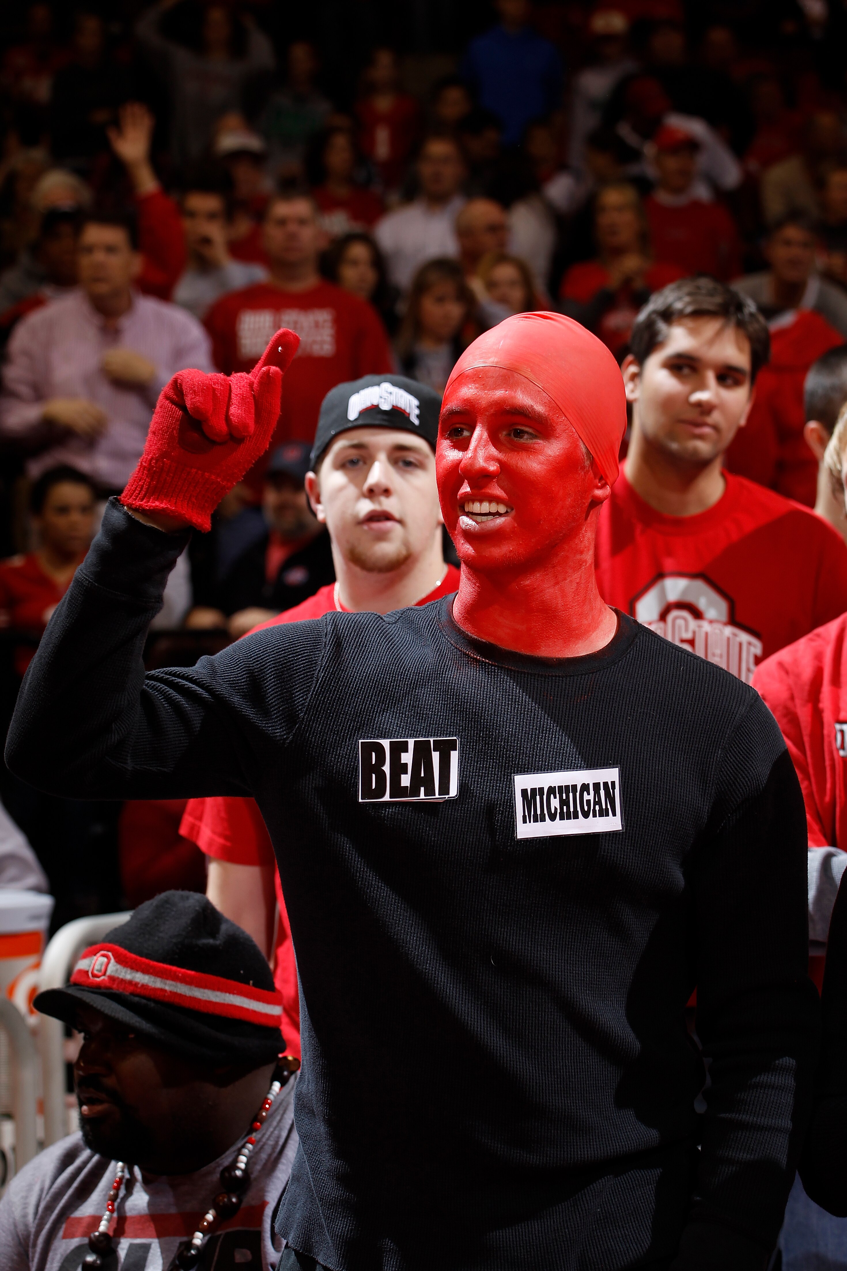 COLUMBUS, OH - NOVEMBER 26: An Ohio State Buckeyes fan wears a shirt with reference to Saturday's Michigan at Ohio State football rivalry game cheers during the game against the Miami RedHawks at Value City Arena on November 26, 2010 in Columbus, Ohio. Oh