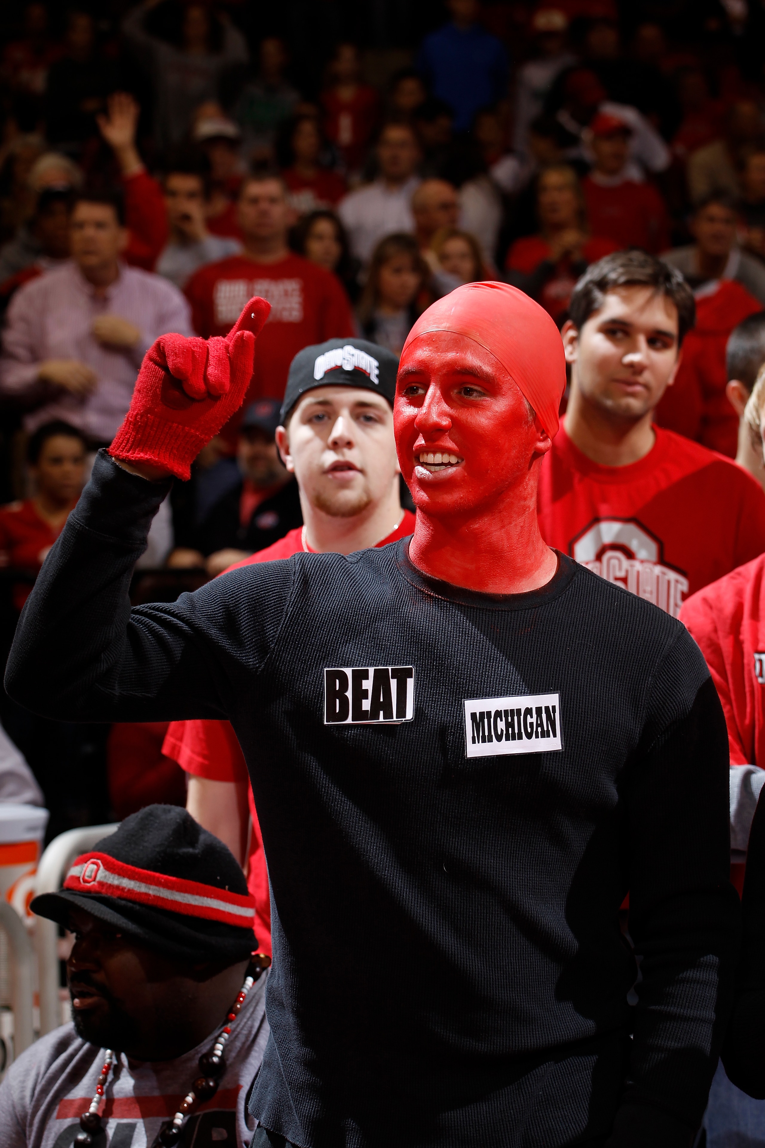 COLUMBUS, OH - NOVEMBER 26: An Ohio State Buckeyes fan wears a shirt with reference to Saturday's Michigan at Ohio State football rivalry game cheers during the game against the Miami RedHawks at Value City Arena on November 26, 2010 in Columbus, Ohio. Oh