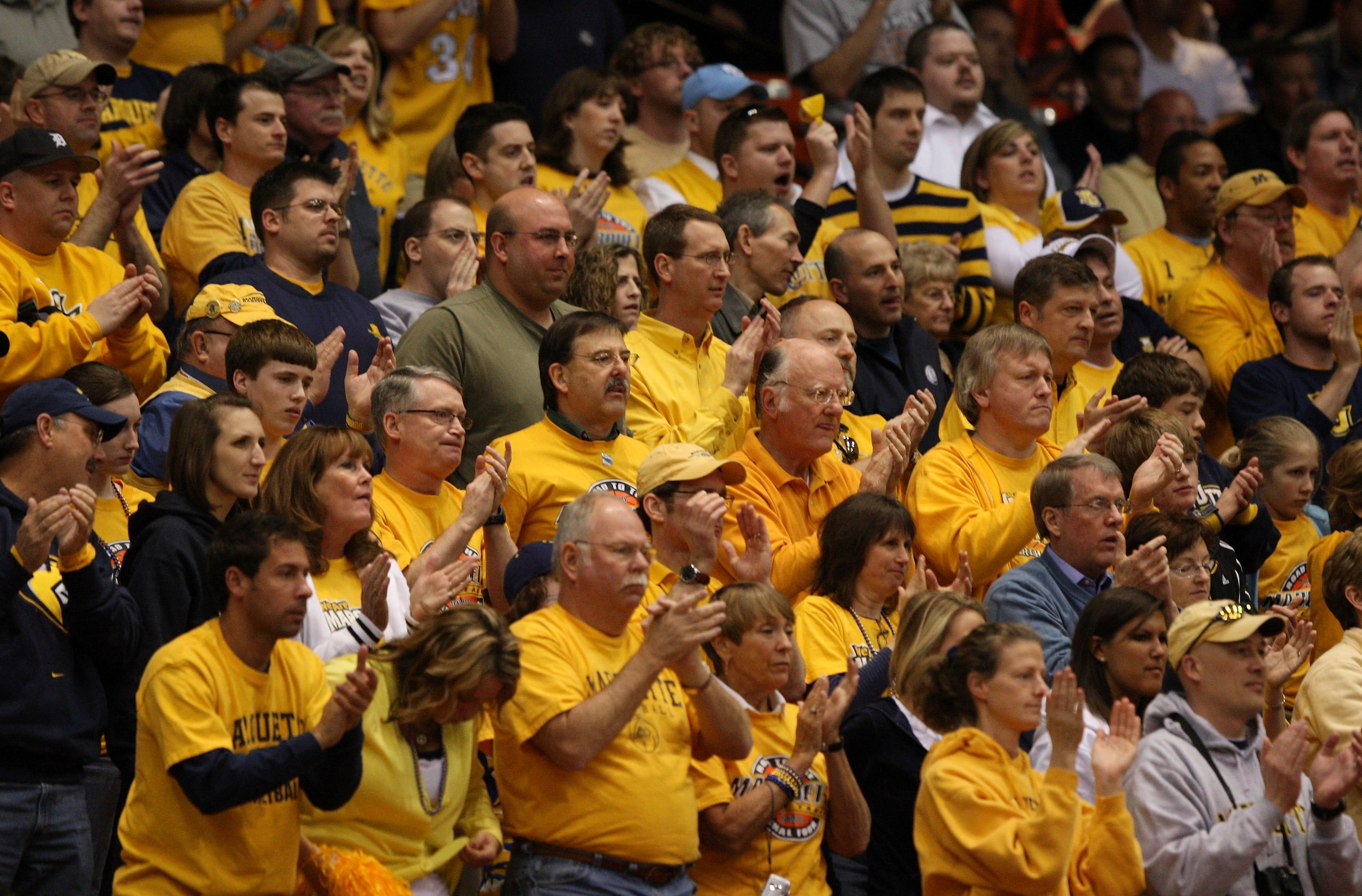 BOISE, ID - MARCH 20:  Fans of the Marquette Golden Eagles cheer during the game against the Utah State Aggies in the first round of the NCAA Division I Men's Basketball Tournament at the Taco Bell Arena on March 20, 2009 in Boise, Idaho.  (Photo by Jed J