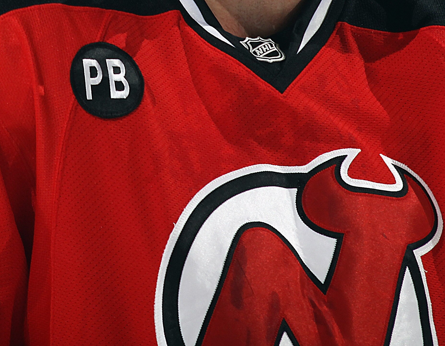 NEWARK, NJ - NOVEMBER 22:  New Jersey Devils players wear a patch honoring former coach Pat Burns during their game against the Washington Capitals at the Prudential Center on November 22, 2010 in Newark, New Jersey.  (Photo by Bruce Bennett/Getty Images)