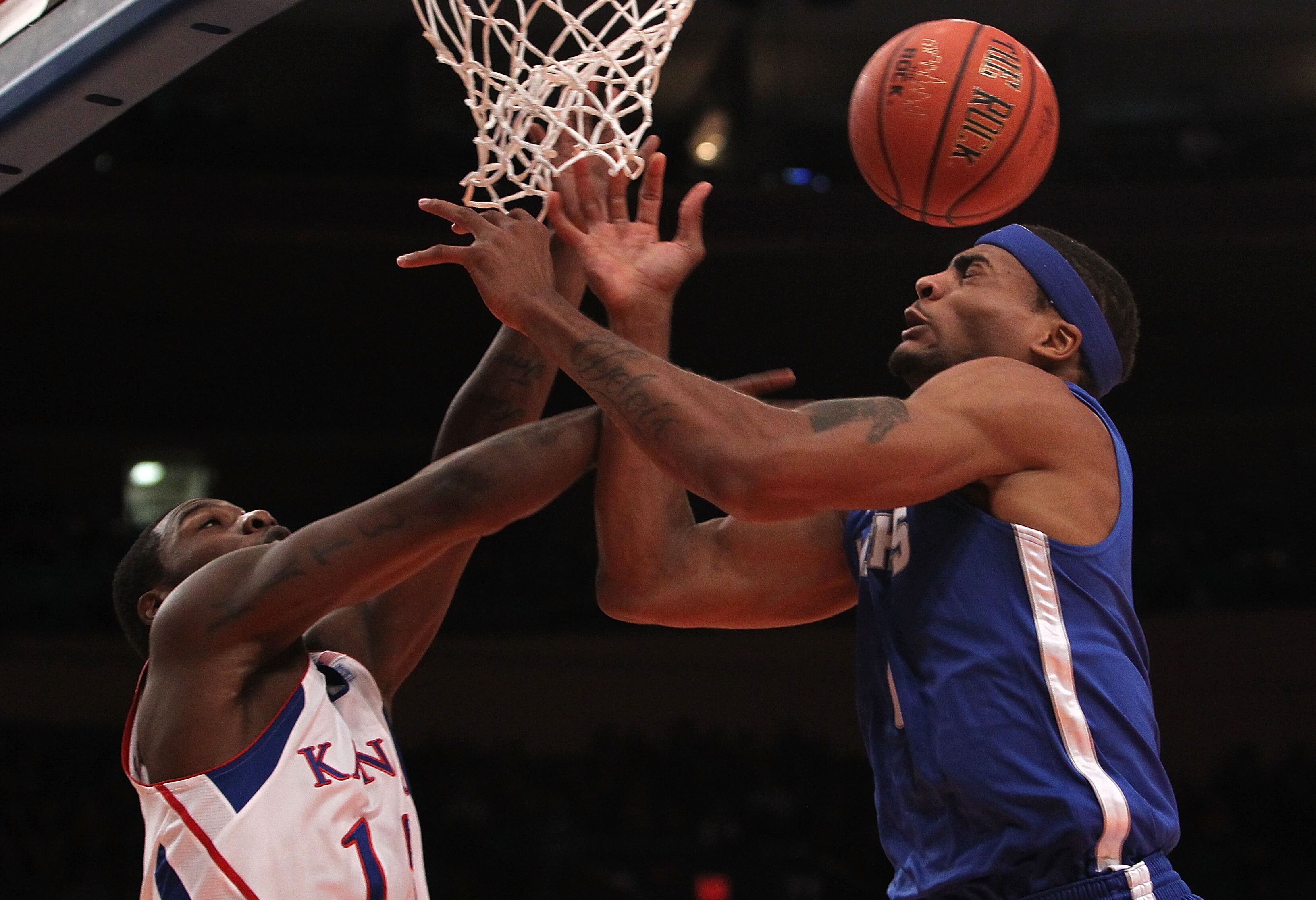 NEW YORK, NY - DECEMBER 07:  Will Coleman #0 of the Memphis Tigers contests a rebound with Elijah Johnson #15 of the Kansas Jayhawks during their game at the Jimmy V Classic at Madison Square Garden on December 7, 2010 in New York City.  (Photo by Nick La
