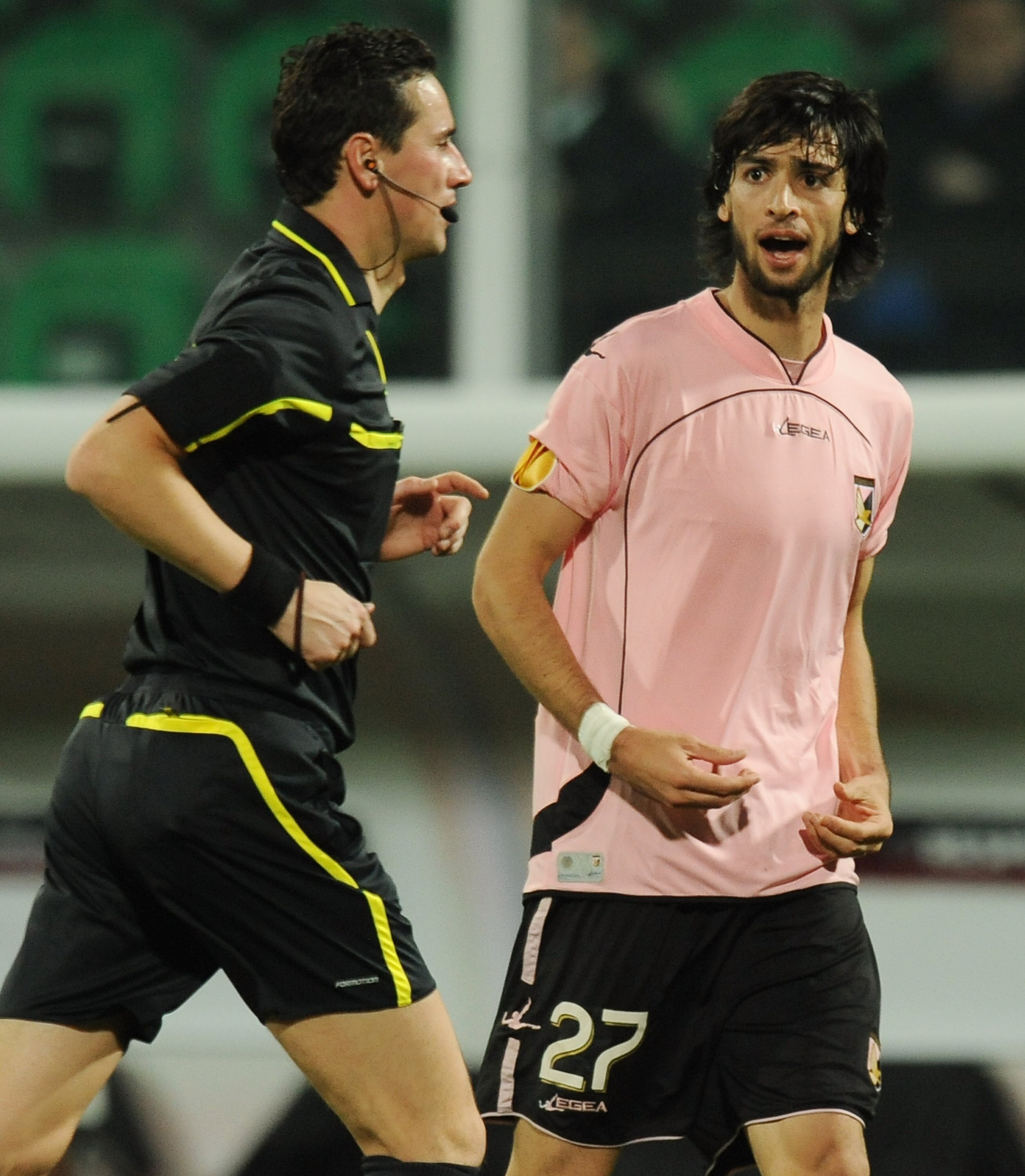 PALERMO, ITALY - DECEMBER 02: Javier Pastore (R) of Palermo speaks to referee Marijo Strahonja during the Uefa Europa League Group F match between Palermo and Sparta Prague at Stadio Renzo Barbera on December 2, 2010 in Palermo, Italy.  (Photo by Tullio M