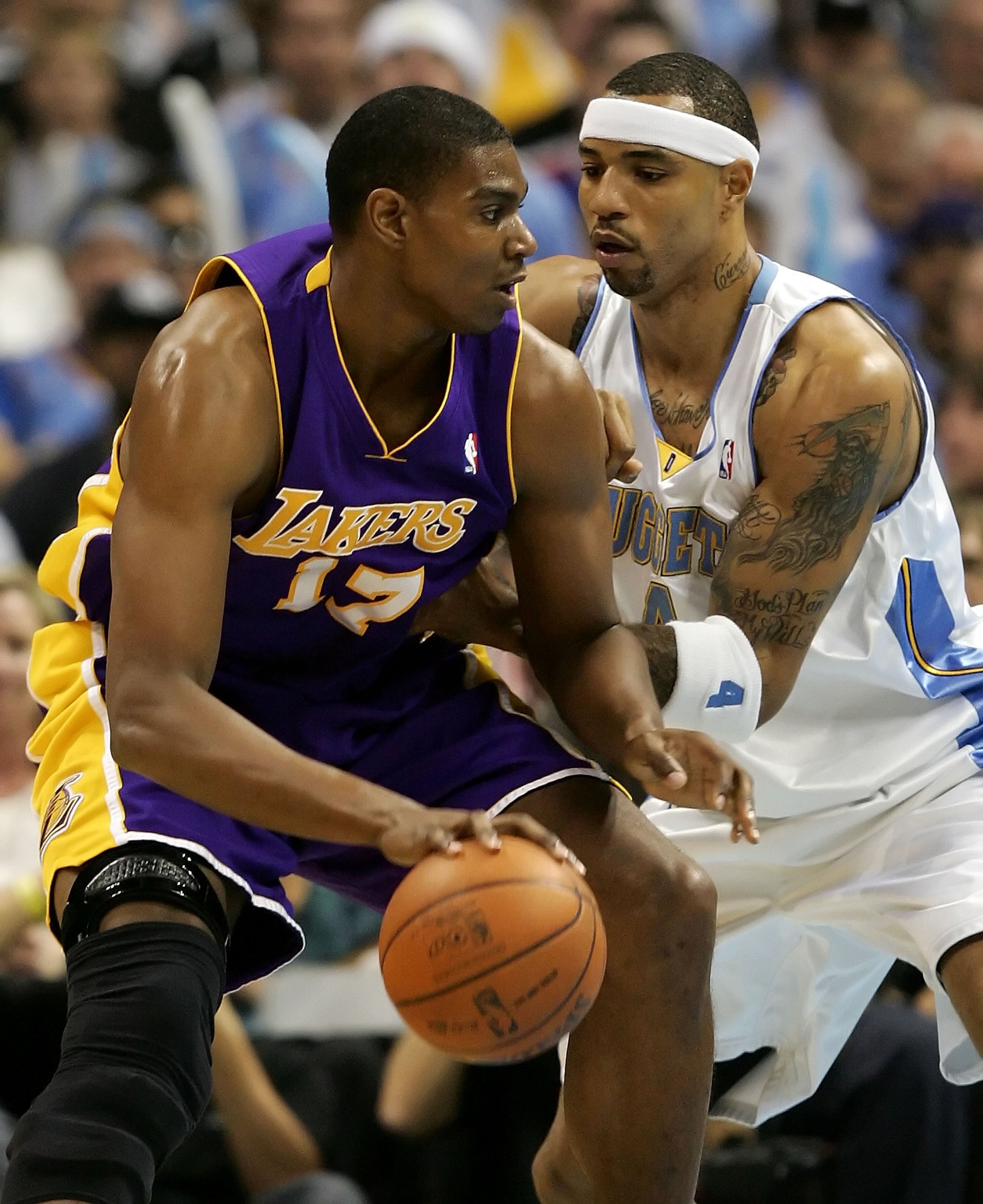DENVER - MAY 23:  Andrew Bynum #17 of the Los Angeles Lakers posts up Kenyon Martn #4 of the Denver Nuggets in Game Three of the Western Conference Finals during the 2009 NBA Playoffs at Pepsi Center on May 23, 2009 in Denver, Colorado. NOTE TO USER: User