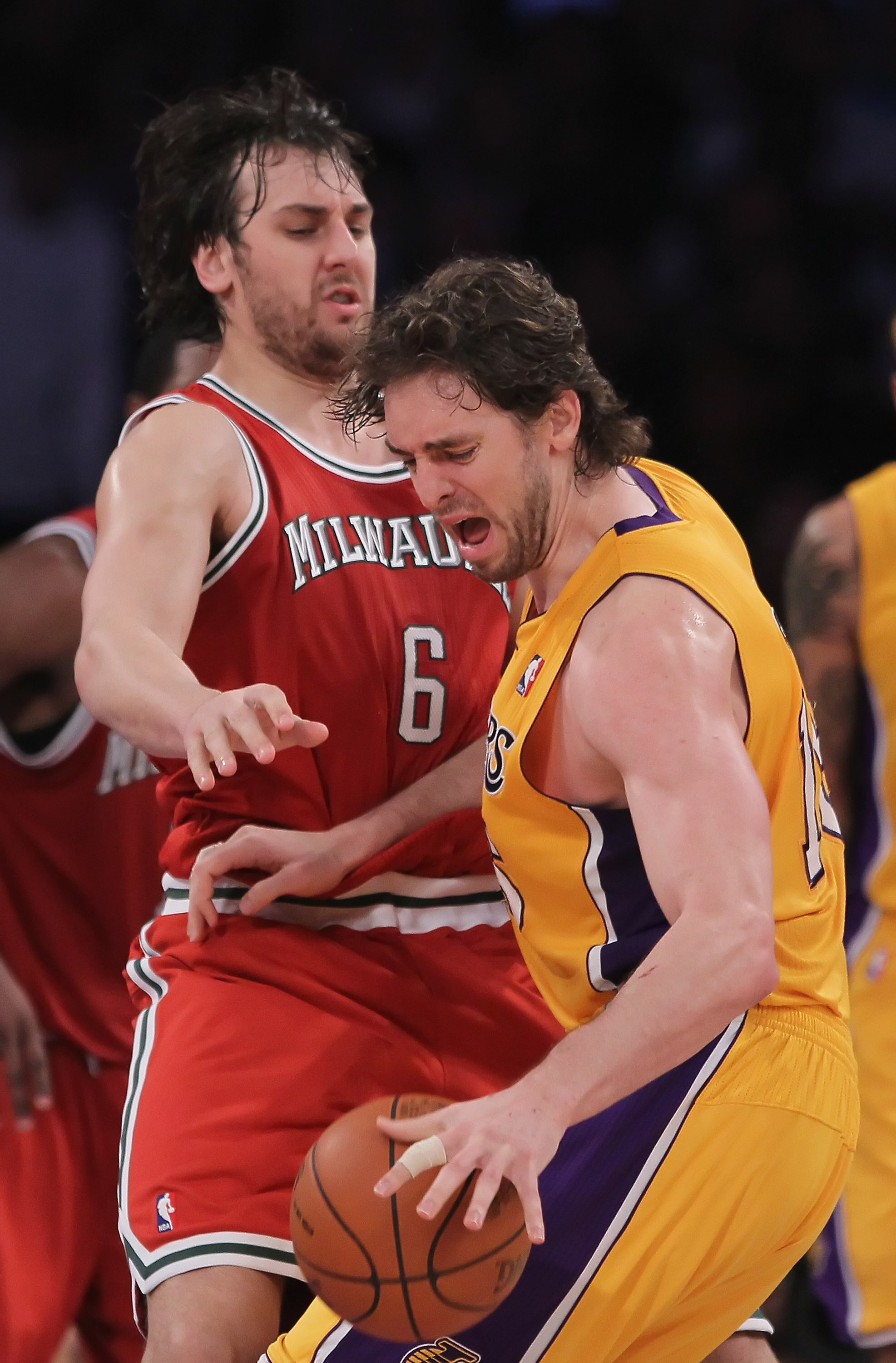 LOS ANGELES, CA - DECEMBER 21:  Pau Gasol #16 of the Los Angeles Lakers is defended by Andrew Bogut #6 of the Milwaukee Bucks during the second half at Staples Center on December 21, 2010 in Los Angeles, California. The Bucks defeated the Lakers 98-79. NO