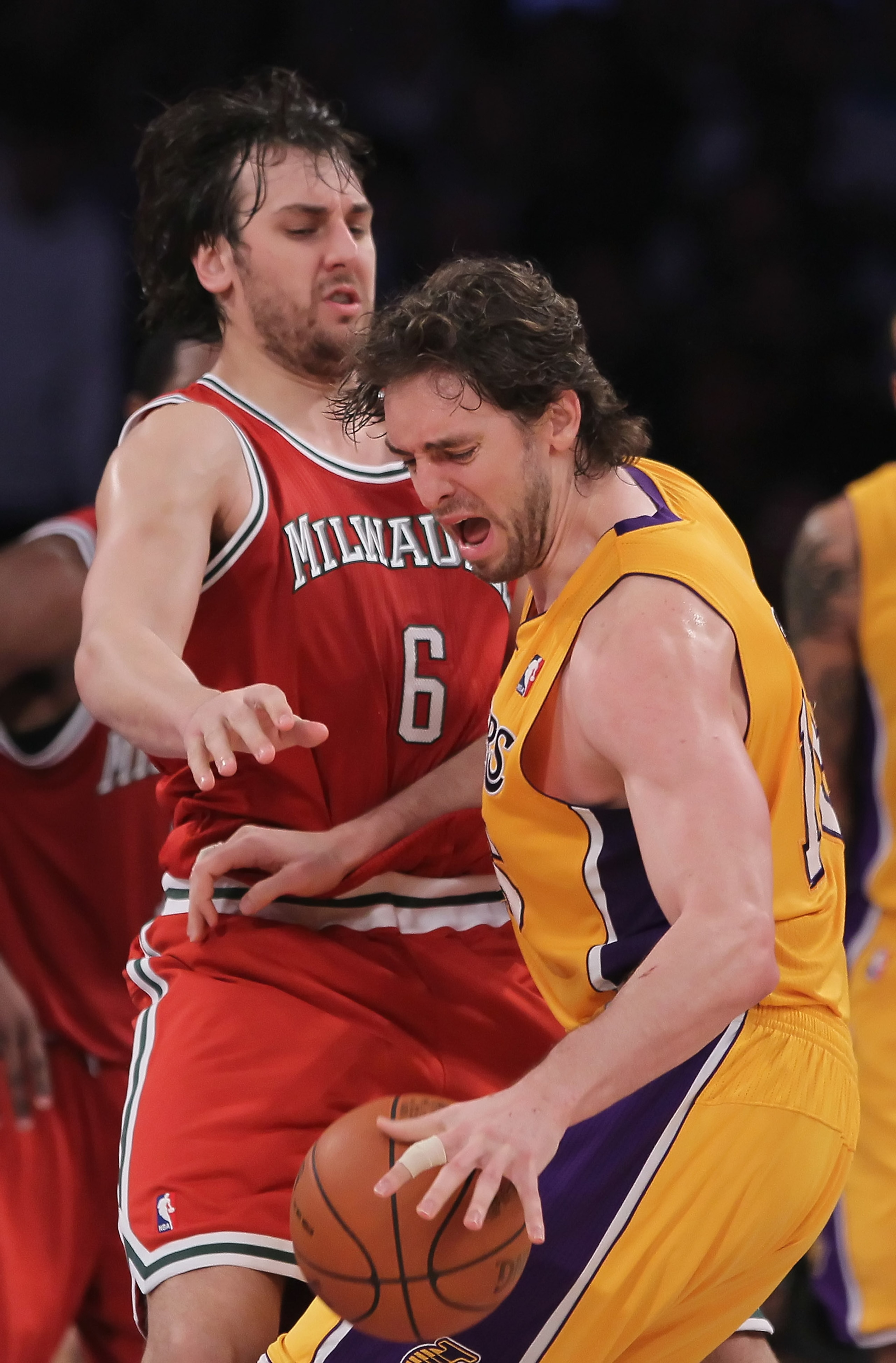 LOS ANGELES, CA - DECEMBER 21:  Pau Gasol #16 of the Los Angeles Lakers is defended by Andrew Bogut #6 of the Milwaukee Bucks during the second half at Staples Center on December 21, 2010 in Los Angeles, California. The Bucks defeated the Lakers 98-79. NO