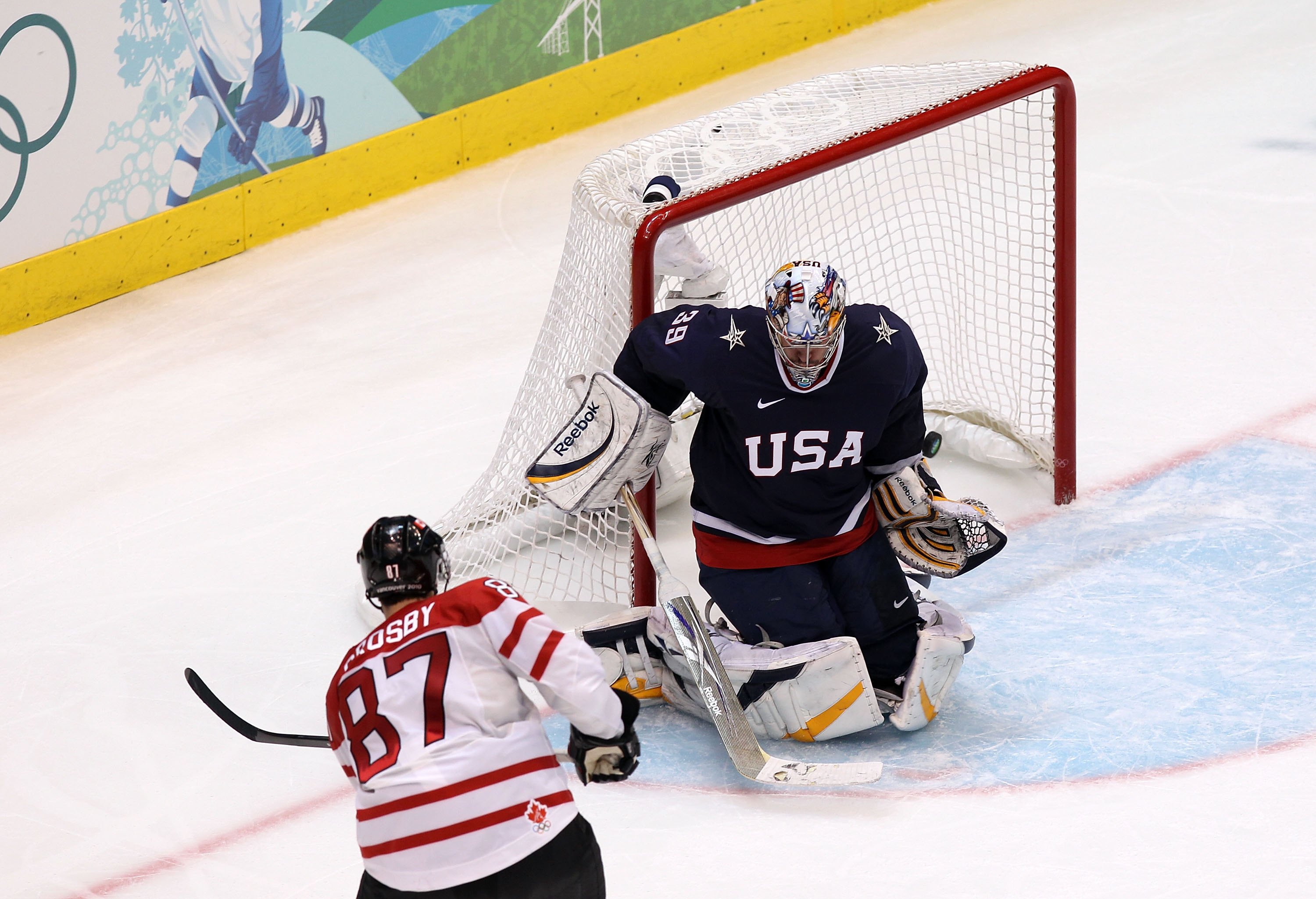 VANCOUVER, BC - FEBRUARY 28:  Sidney Crosby #87 of Canada scores the game-winning goal in overtime against Ryan Miller #39 of USA  in the ice hockey men's gold medal game between USA and Canada on day 17 of the Vancouver 2010 Winter Olympics at Canada Hoc