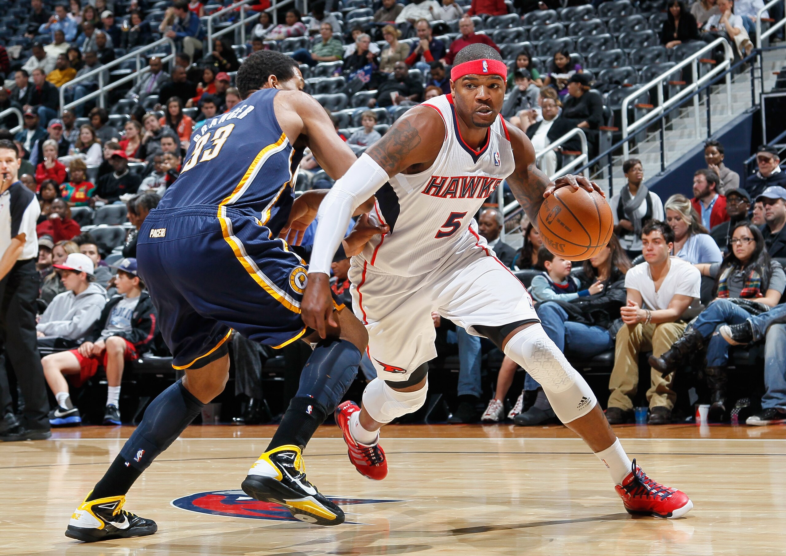 ATLANTA, GA - DECEMBER 11:  Josh Smith #5 of the Atlanta Hawks against Danny Granger #33 of the Indiana Pacers at Philips Arena on December 11, 2010 in Atlanta, Georgia.  NOTE TO USER: User expressly acknowledges and agrees that, by downloading and/or usi
