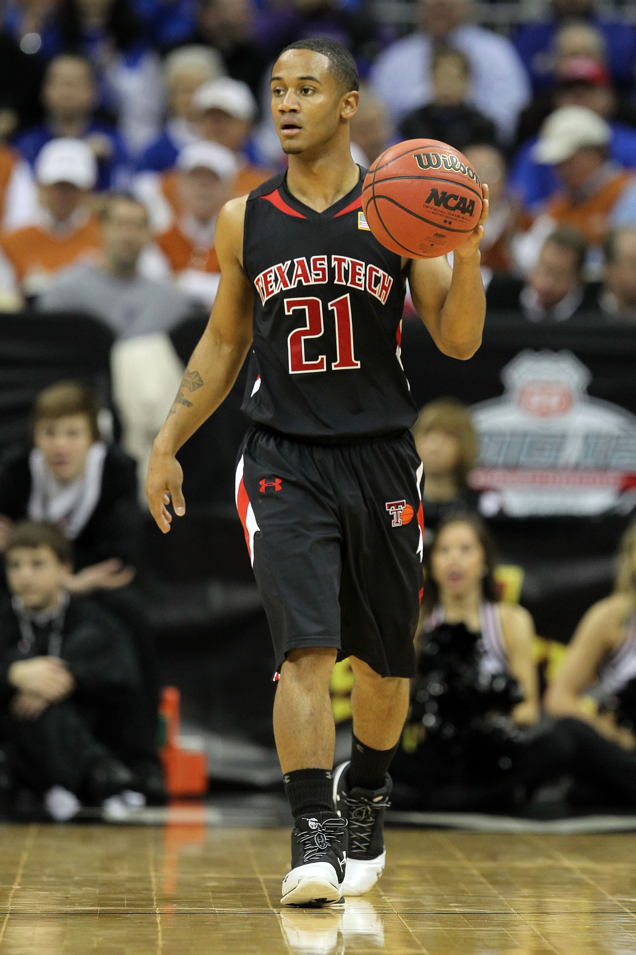 KANSAS CITY, MO - MARCH 11: John Roberson #21 of the Texas Tech Red Raiders moves the ball against the Kansas Jayhawks during the quarterfinals of the 2010 Phillips 66 Big 12 Men's Basketball Tournament at the Sprint Center on March 11, 2010 in Kansas Ci KANSAS CITY, MO - MARCH 11: John Roberson #21 of the Texas Tech Red Raiders moves the ball against the Kansas Jayhawks during the quarterfinals of the 2010 Phillips 66 Big 12 Men's Basketball Tournament at the Sprint Center on March 11, 2010 in Kansas Ci