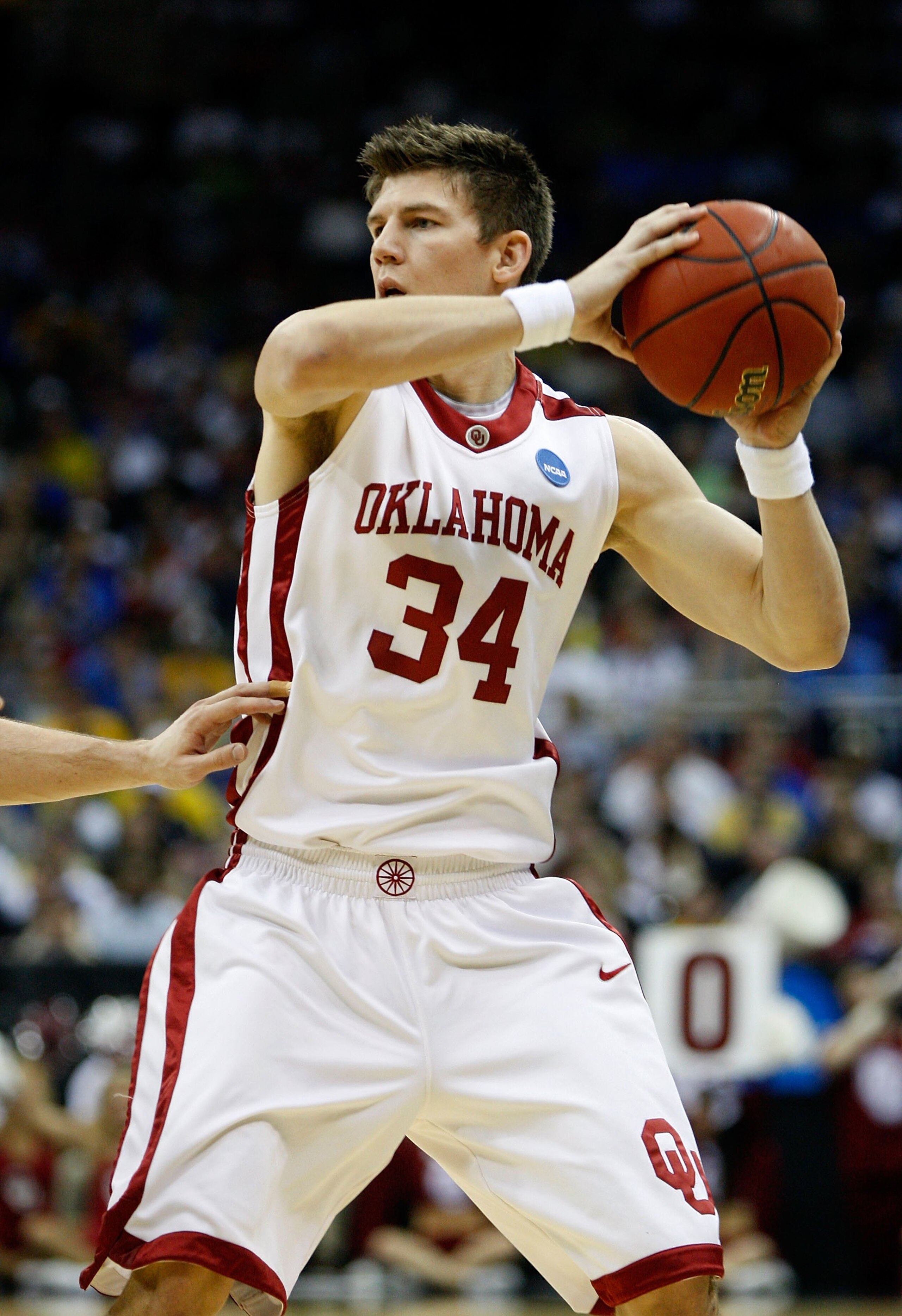 KANSAS CITY, MO - MARCH 21: Cade Davis #34 of the Oklahoma Sooners looks to make a play with the ball during their second round game against the Michigan Wolverines in the NCAA Division I Men's Basketball Tournament at the Sprint Center on March 21, 2009 KANSAS CITY, MO - MARCH 21: Cade Davis #34 of the Oklahoma Sooners looks to make a play with the ball during their second round game against the Michigan Wolverines in the NCAA Division I Men's Basketball Tournament at the Sprint Center on March 21, 2009